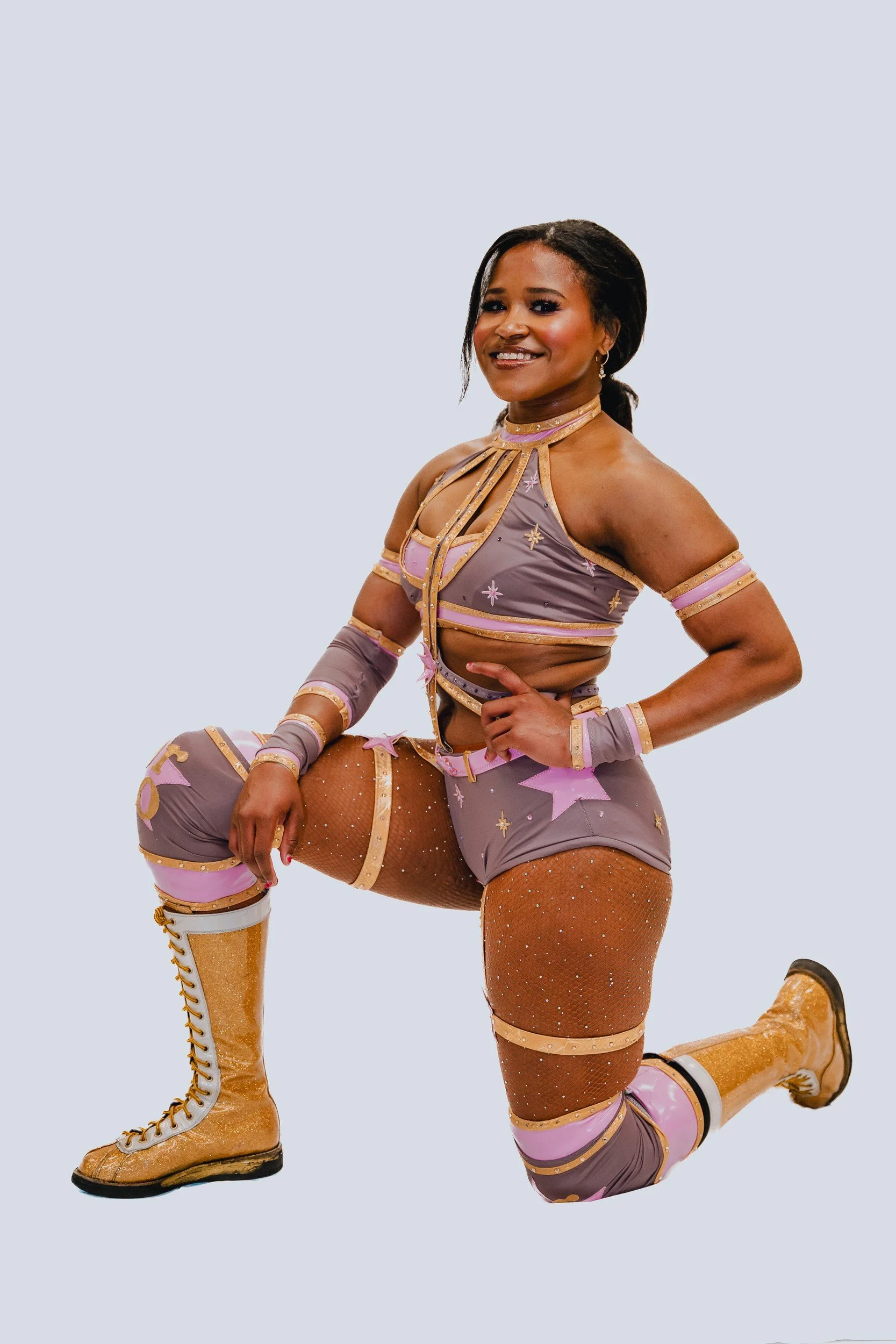 Kneeling performer portrait.
