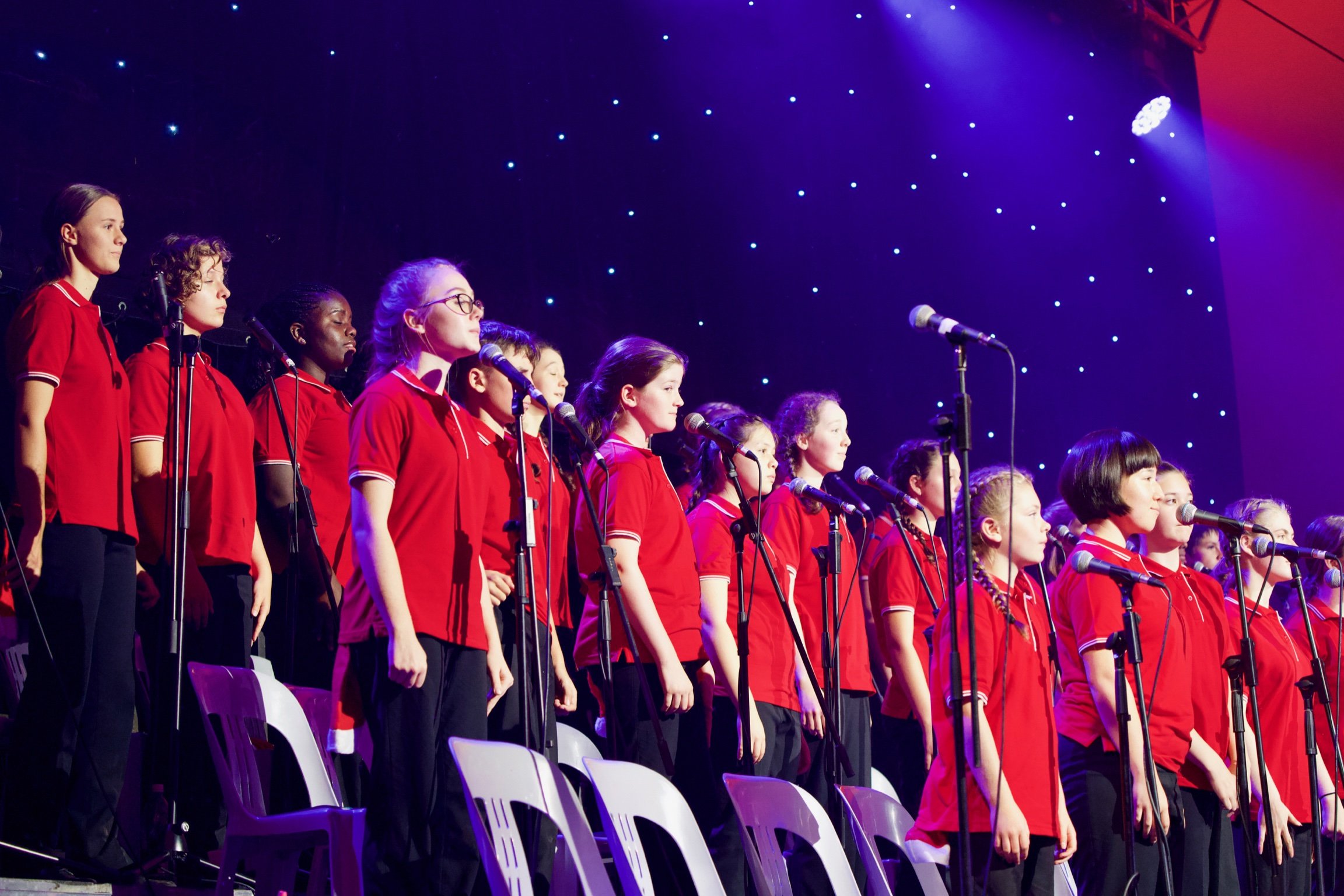 Woden Valley Youth Choir on stage for Carols by Candlelight.
