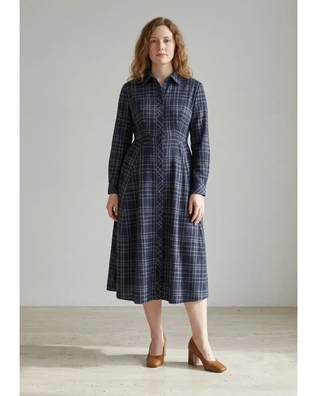 Pear body shape outfit featuring a navy plaid shirt dress belted at the waist