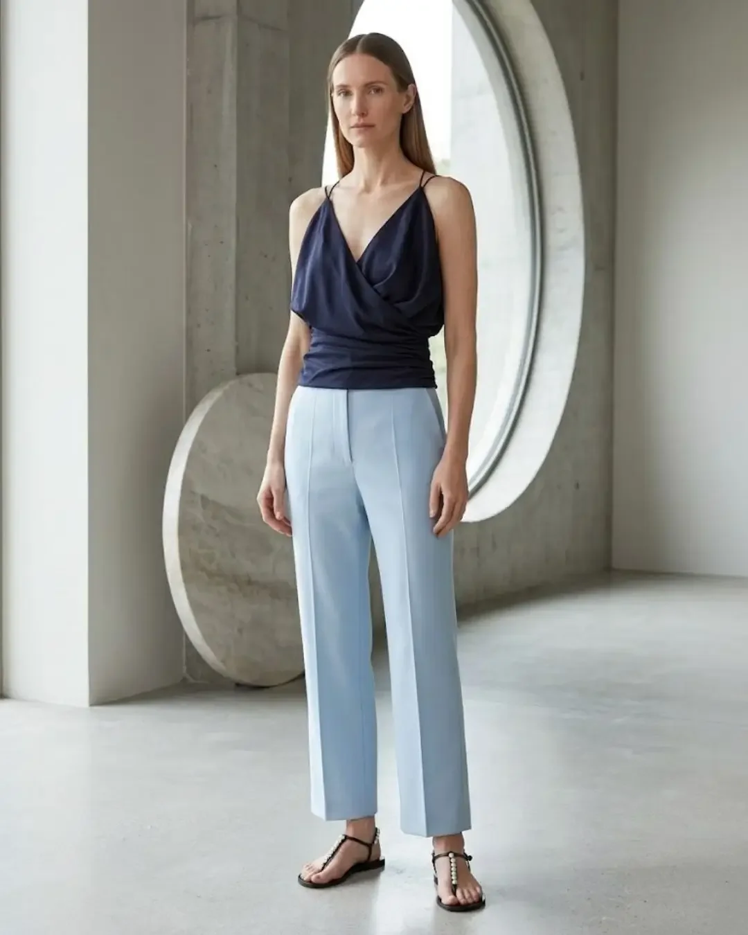 Navy cami with light blue cropped trousers — depth and sky tones in the Dalí spring capsule wardrobe 2026.