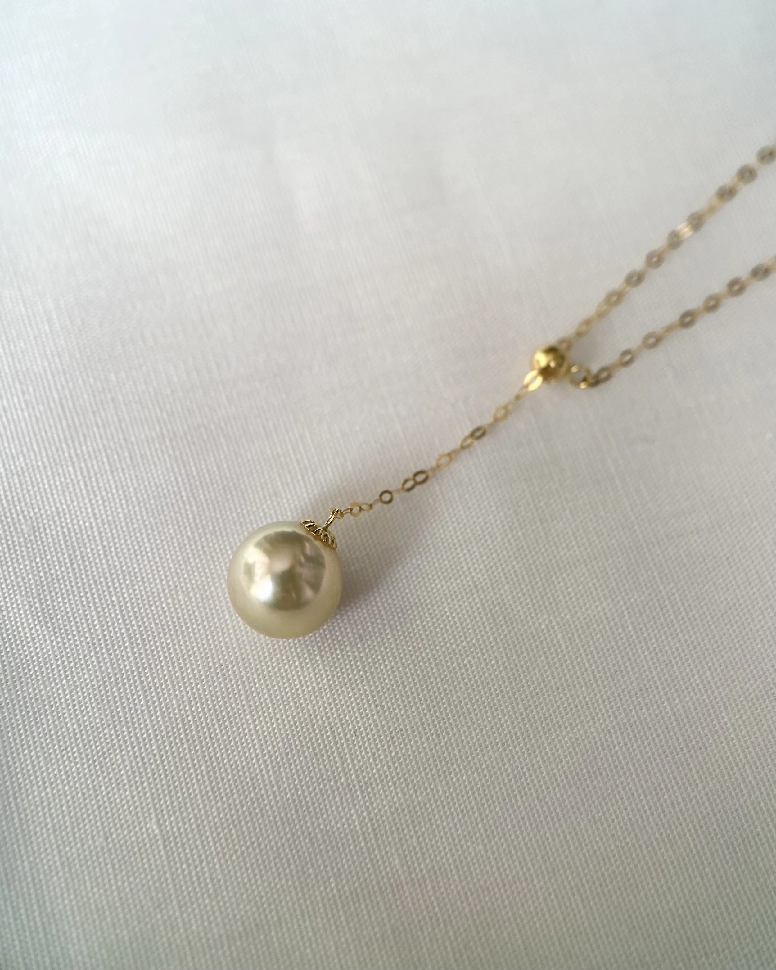 Radiant 8-8.5mm Japanese Amami Oshima Seawater Cultured Golden Pearl Earrings, Hint of Lime Green Overtones, 18K Gold Dangle Settings, Spotlight Luxury