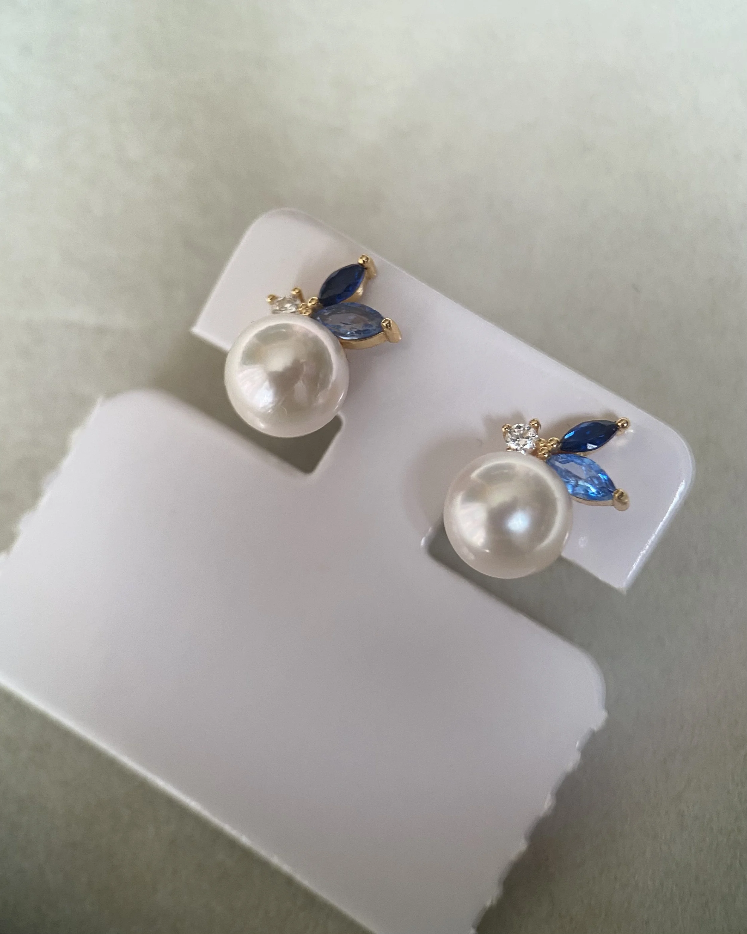 Japanese Exhibition 7.9mm Classic White Akoya Pearl Stud Earrings, Sapphire Blue Botanical Leaf Design, S925 Silver with CZ Accents Starlit Pearls