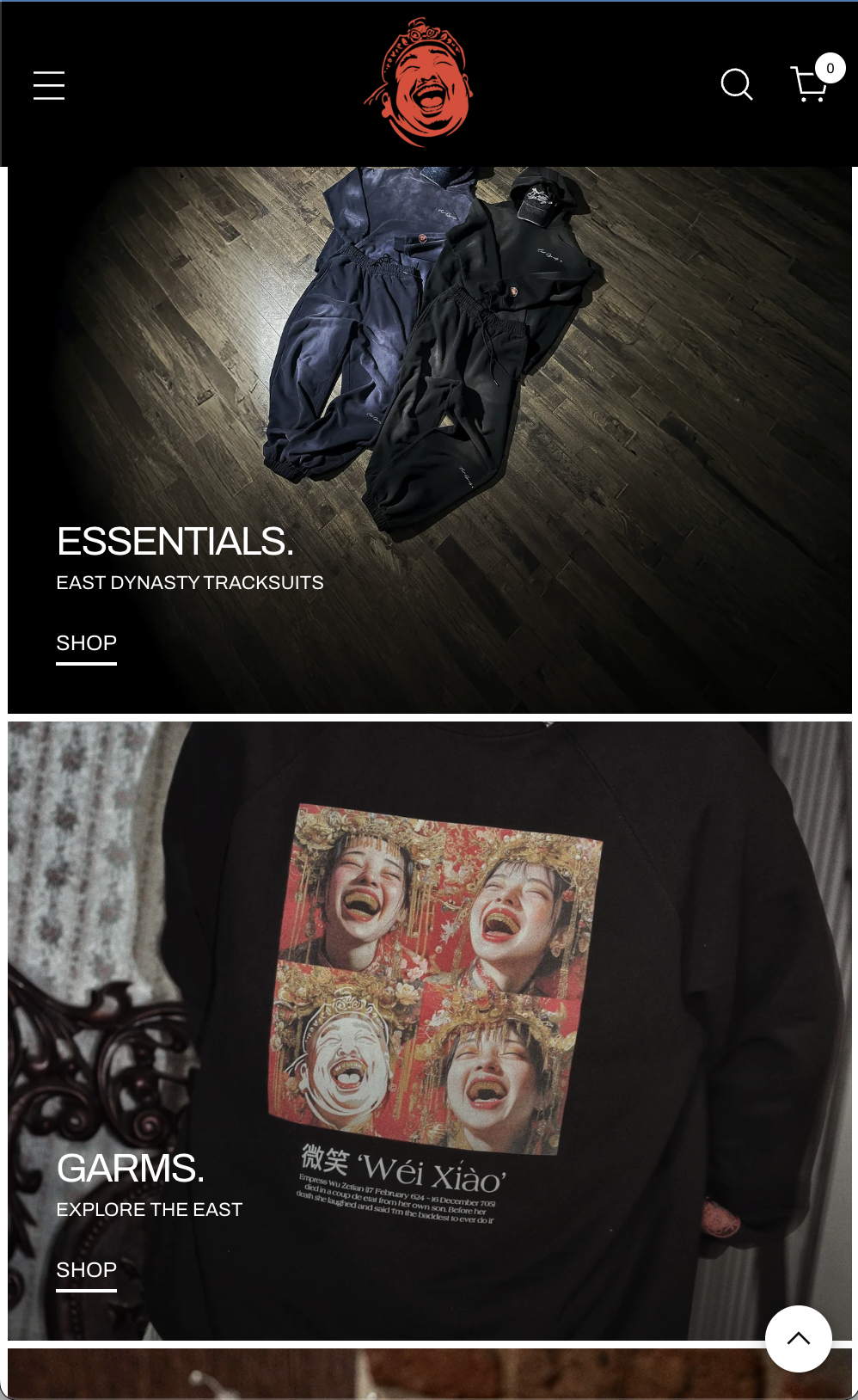 Two tracksuits, one black and one dark blue, laid out on a wooden floor. The website features sections for 'ESSENTIALS' and 'GARMS', with text promoting East Dynasty Tracksuits and a collage of four laughing people on a black sweatshirt.
