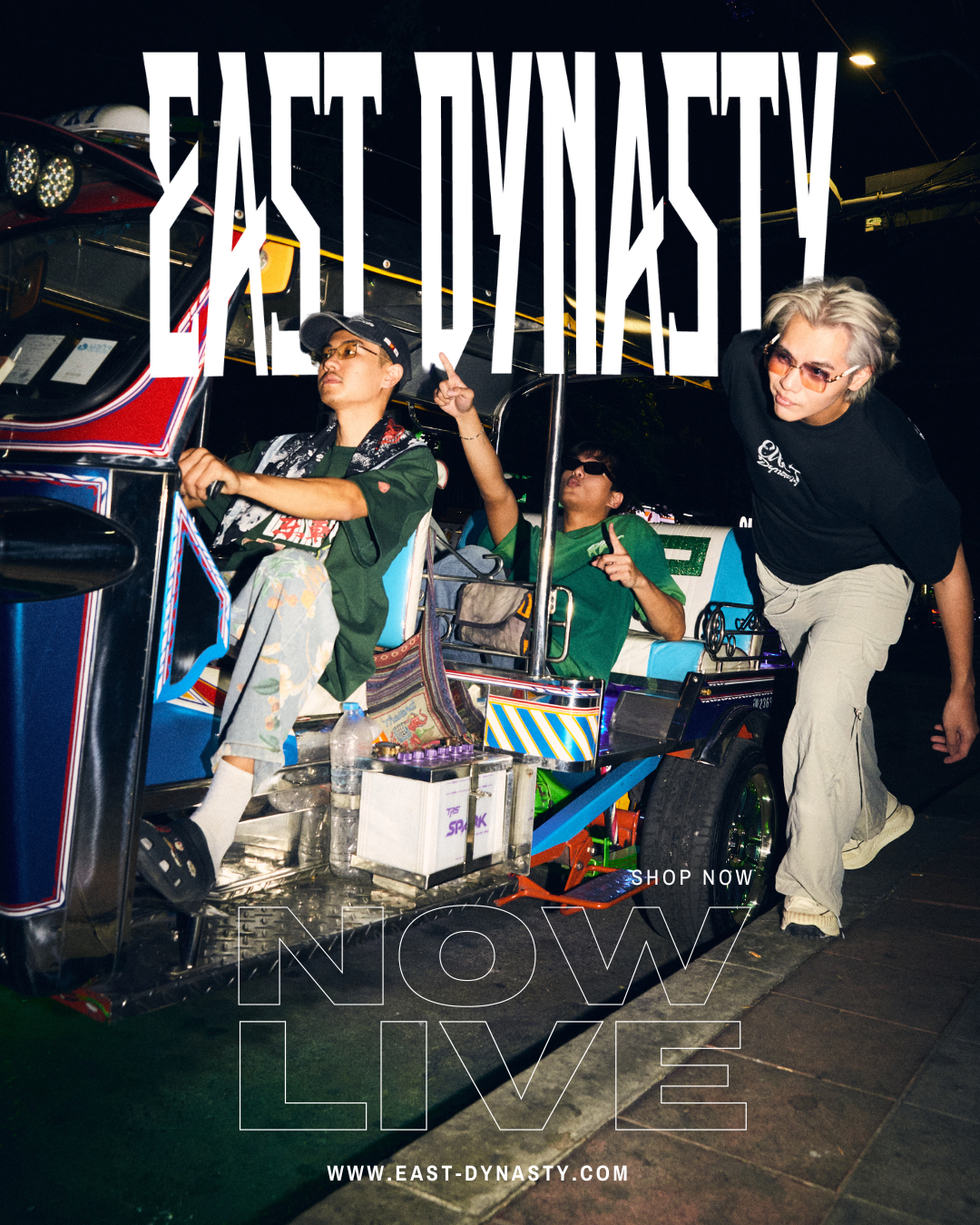 People riding in a colorful tuk-tuk or auto rickshaw at night, with overlay text promoting East Dynasty fashion and website.
