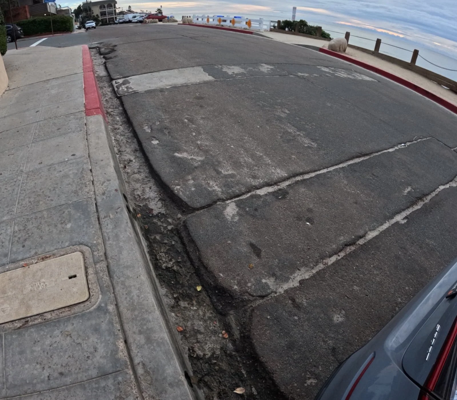 Neptune Place in need of street resurfacing or long term concrete repaving.