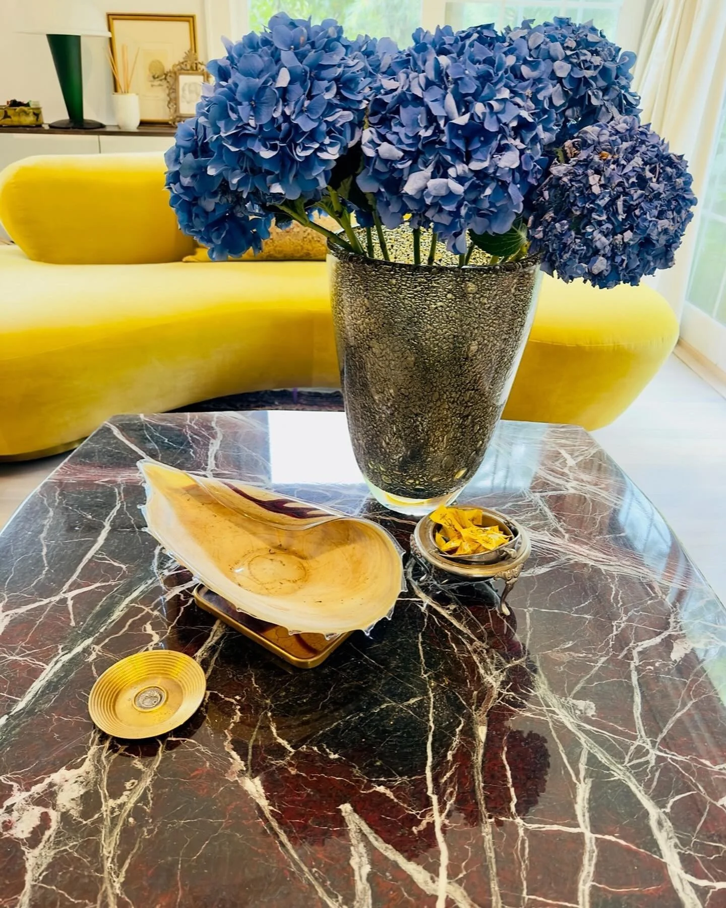 We love color!!! Our Alain Delon Coffee Table for Maison Jansen has the perfect Red Rosso Marble top paired with our stunning Serpentine Kagan Sofa. Accessories by Murano Venice and Lalaounis. DM us for more details #vladimirkagan #serpentinesofa #co