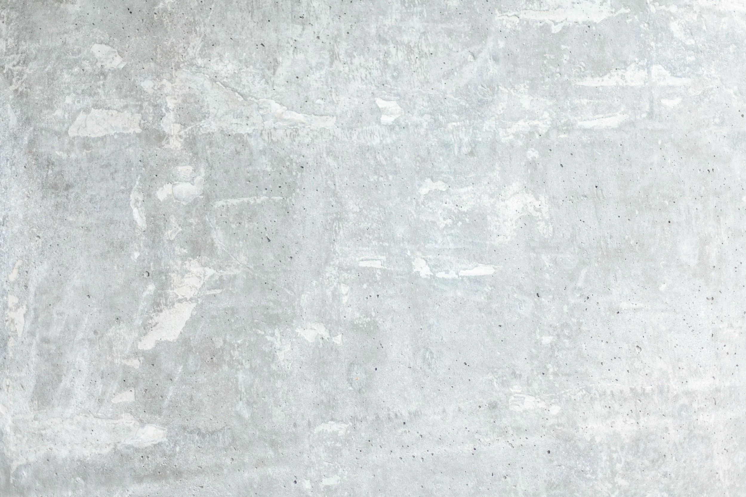 Gray concrete wall with a rough texture.