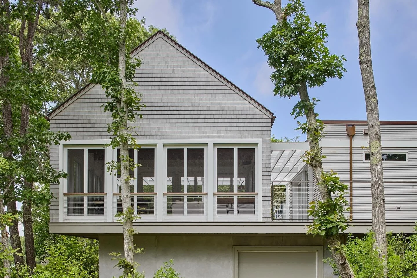 Some exterior views from the rear of our Cape Cod poolhouse project! The main structure is cantilevered to give it a treehouse vibe and to protect from local flooding. 

Builder: Steve Mellor
Interiors: Nancy Matthews
Photos: Jane Messinger

#poolhou