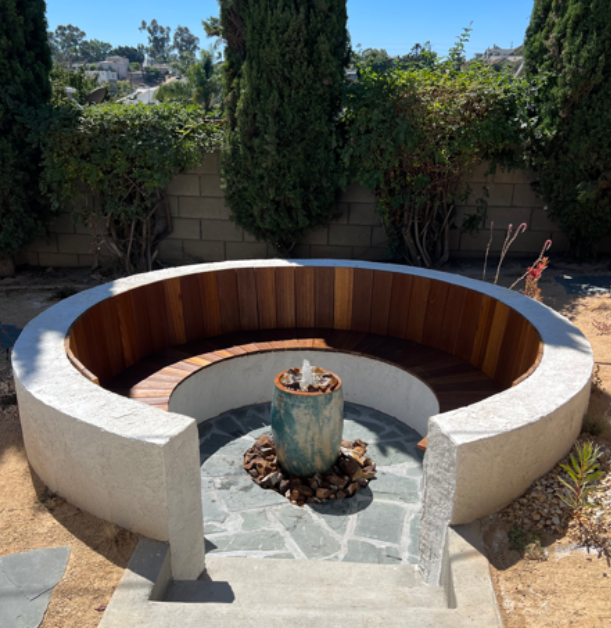 Custom sunken seating with water feature in the middle