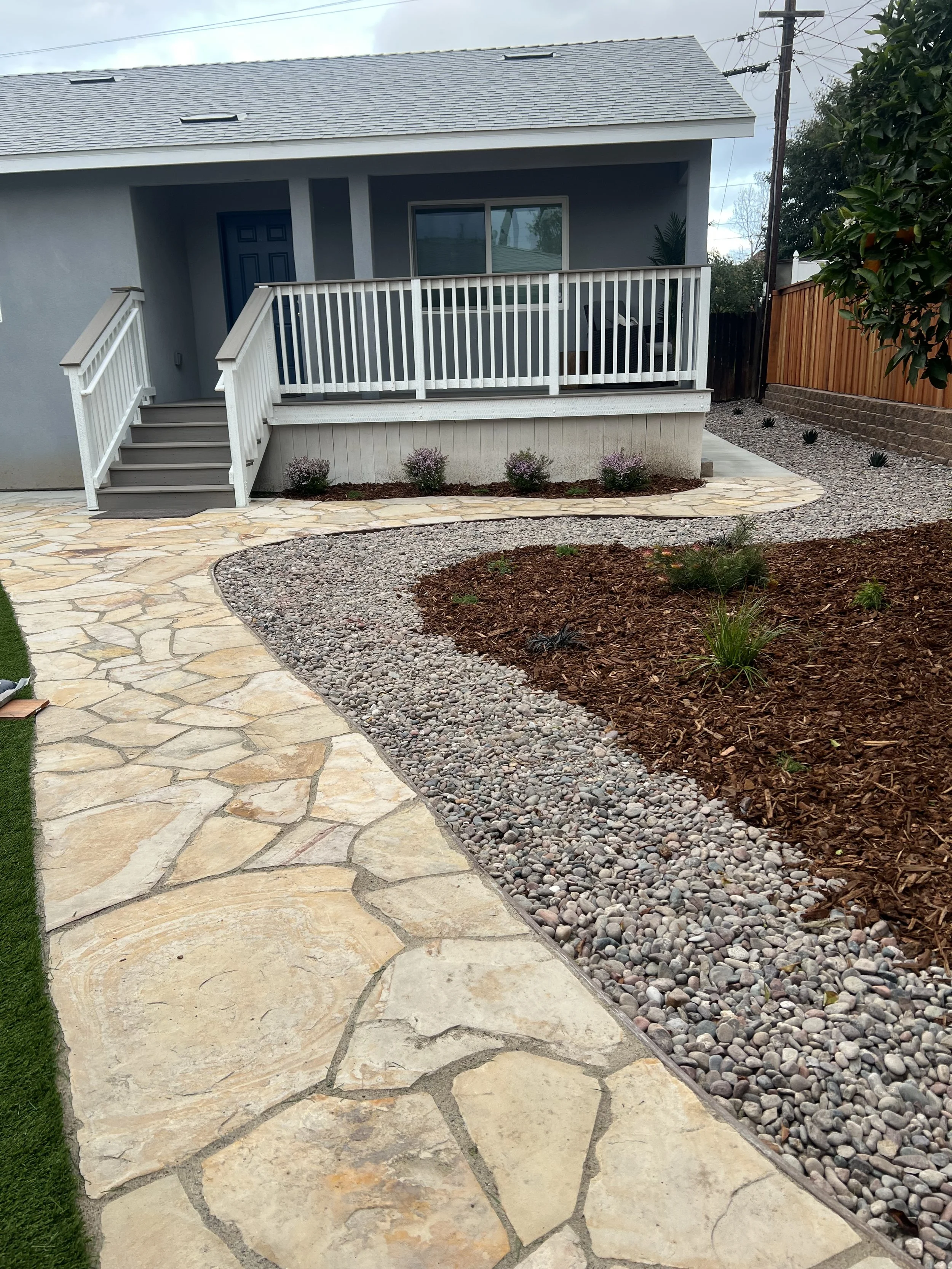 front yard remodel with flagstone pathway