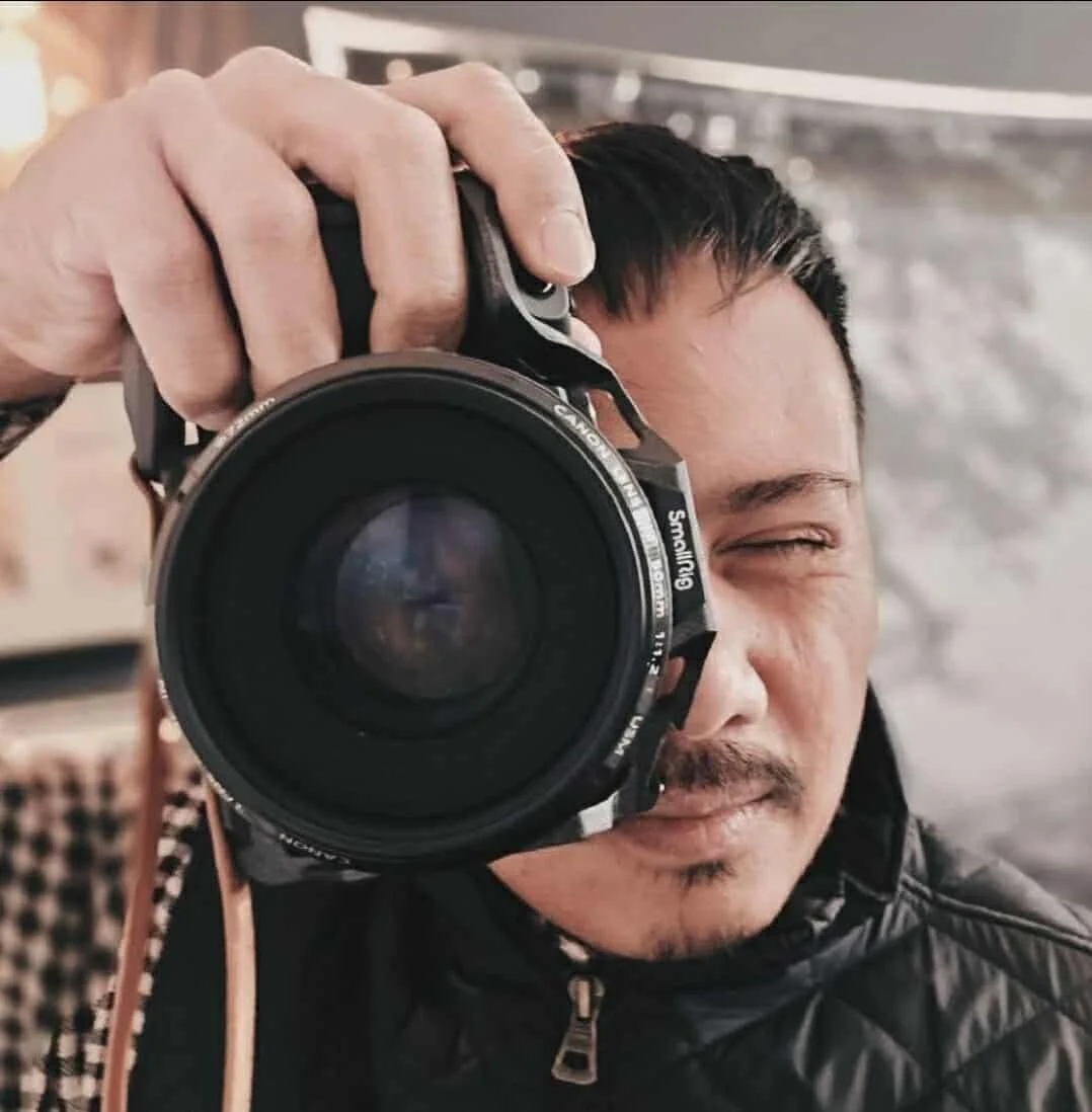 Orange house icon with a chimney on a white background.