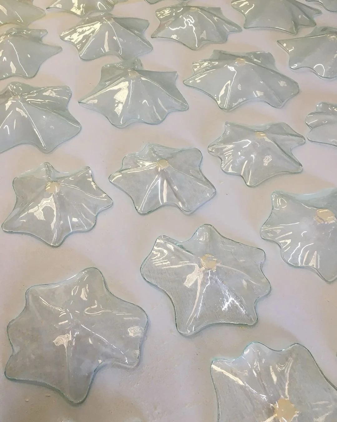 The creation of our Falling (glass) Leaves is an intricate process. 

Each leaf begins with a 3D printed mould, crafted individually to capture a unique size and shape. The printed mould is then pressed into a bed of sand to create a negative mass. 
