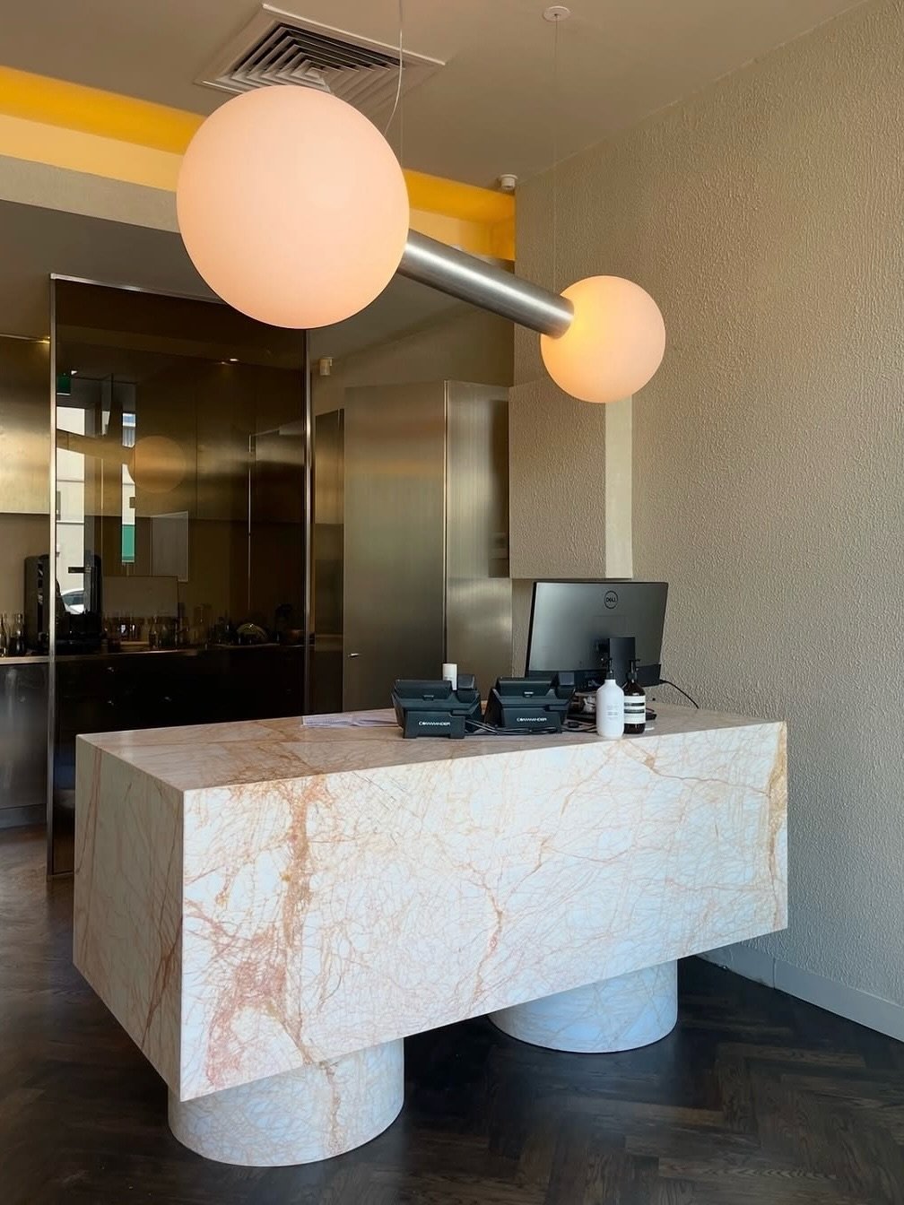 The custom pendant&rsquo;s impressive size works beautifully with the marble counter, making them both standout features at @toniandguybrighton. 

The bold and mighty suspended luminaire adorns the renovated reception area by @designbygolden.

#madei