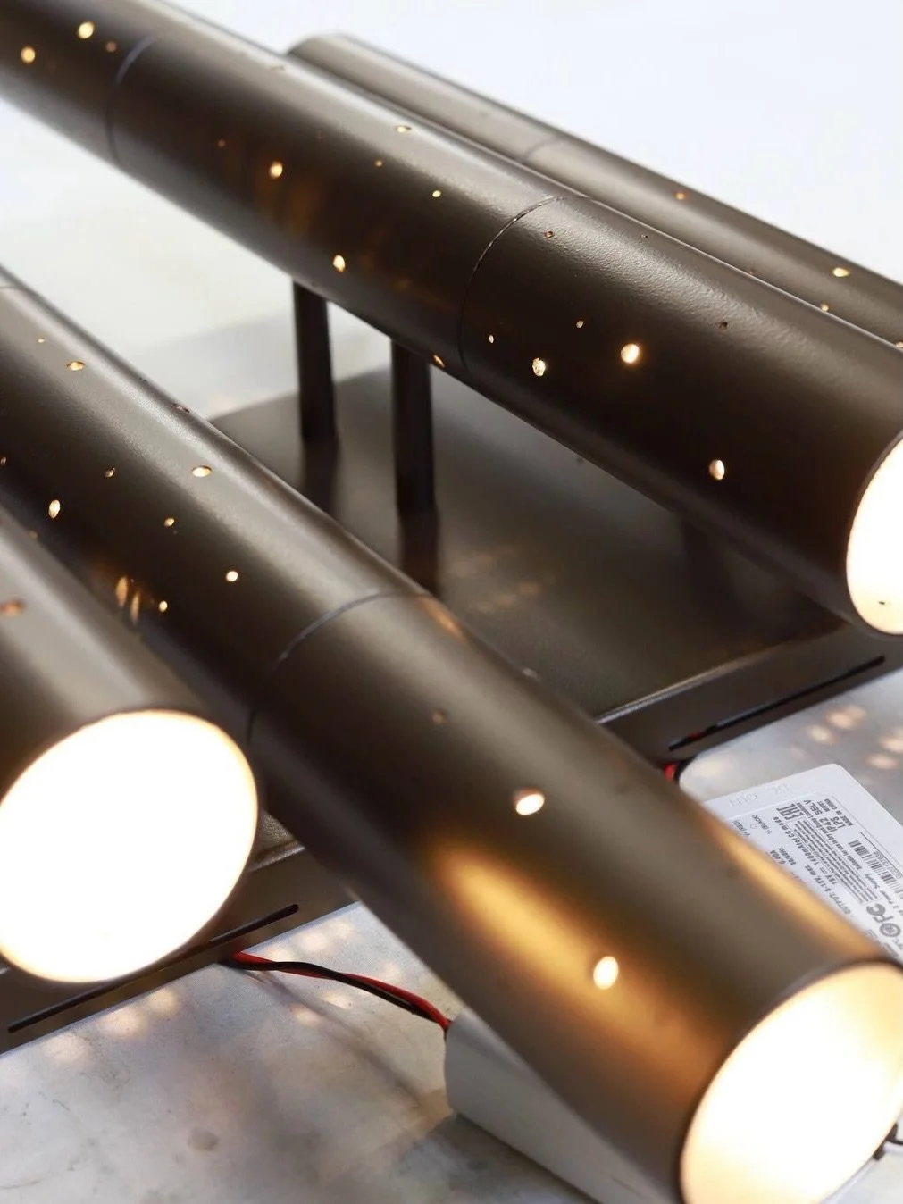 Bringing the beauty of the night sky into your space, the Stardust Fluted Wall Light.

Its hand-perforated design creates a dreamy effect, like distant galaxies scattered across a dark expanse. Functional for both indoor and outdoor use, it adds a qu