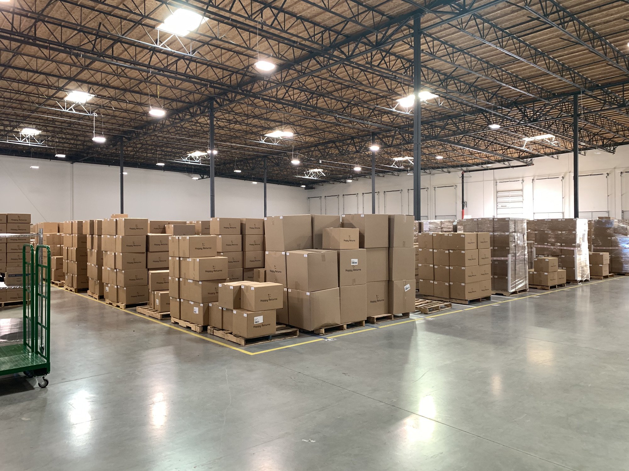 Shipping boxes on pallets. Once the pallet is full, it’s weighed, wrapped and placed in storage until it’s ready to be loaded onto a shipping truck.