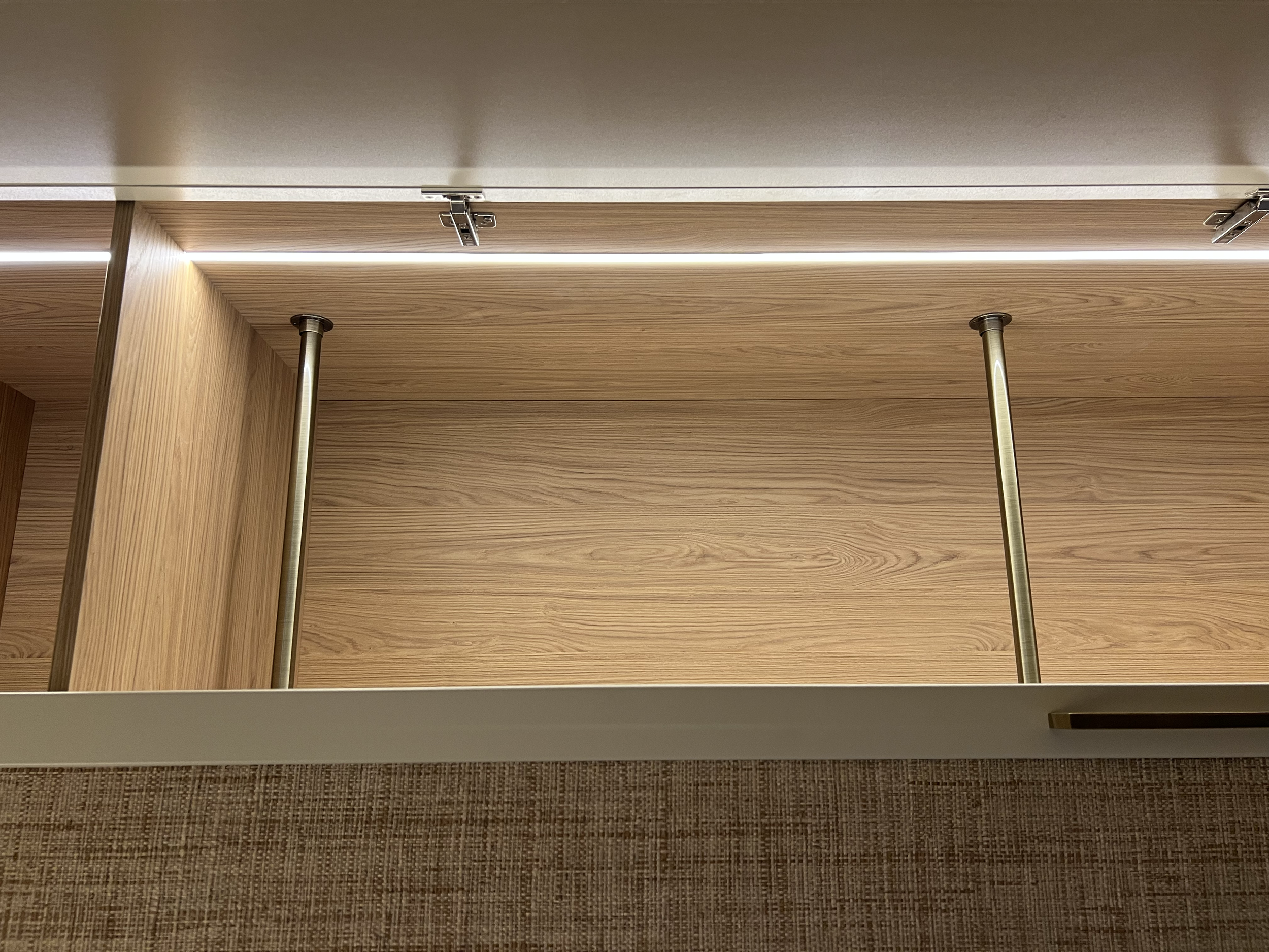 “Bespoke wardrobe design with custom shelving and hanging space in modern family home.”