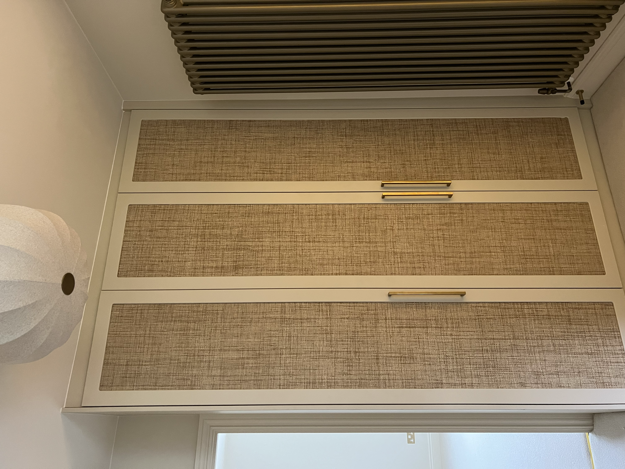 “Bespoke wardrobe design with custom shelving and hanging space in modern family home.”