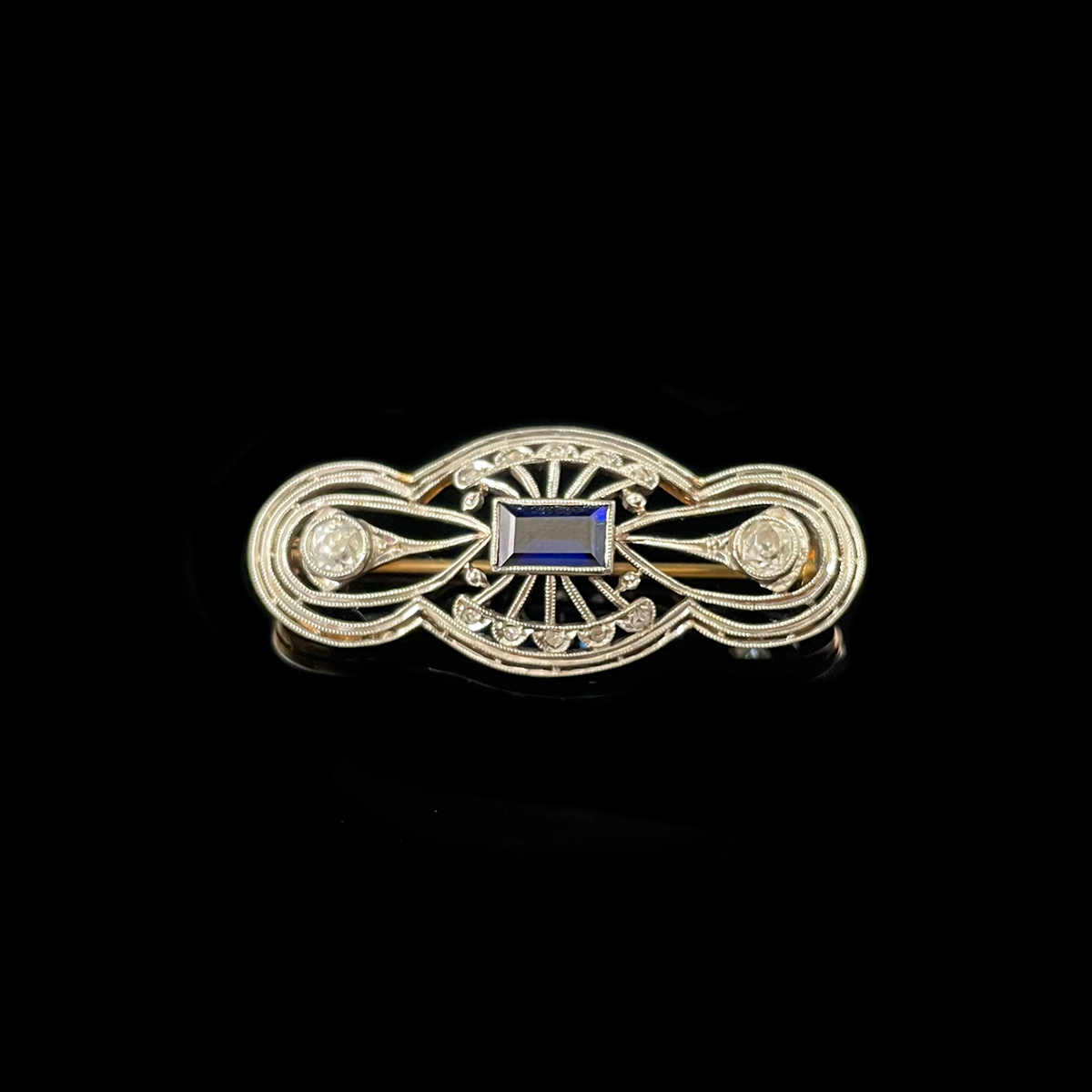 Platinum-Topped 18K Yellow Gold Synthetic Sapphire and Diamond Brooch.png