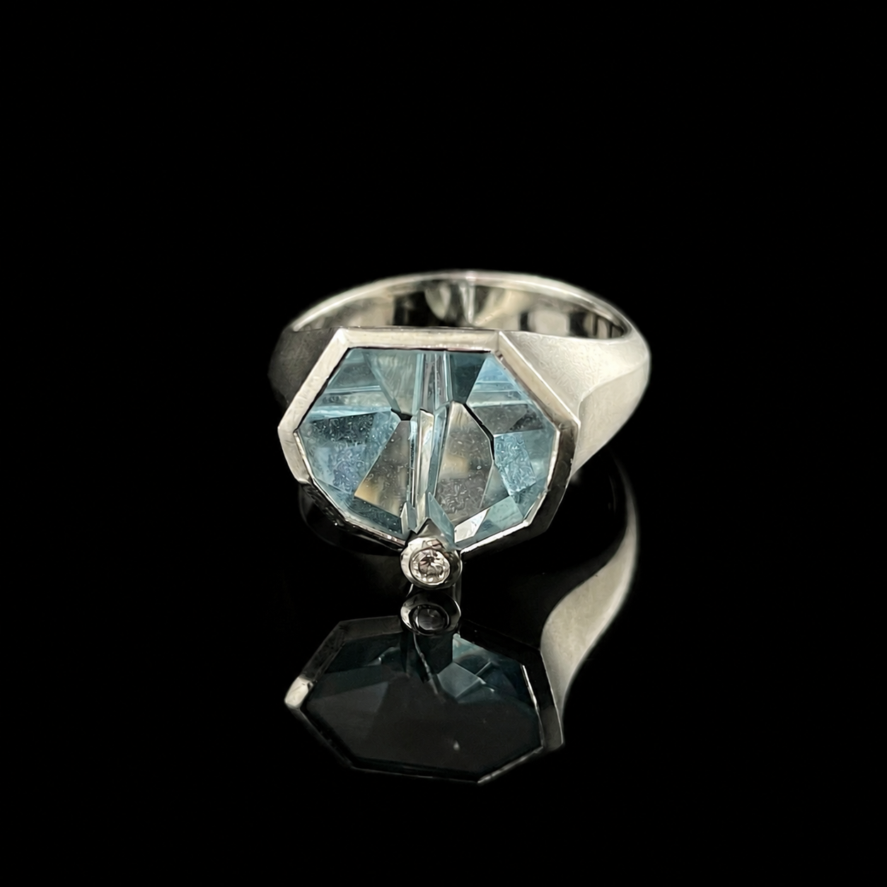 Platinum Carved Aquamarine and Diamond Ring by Tom Munsteiner.png