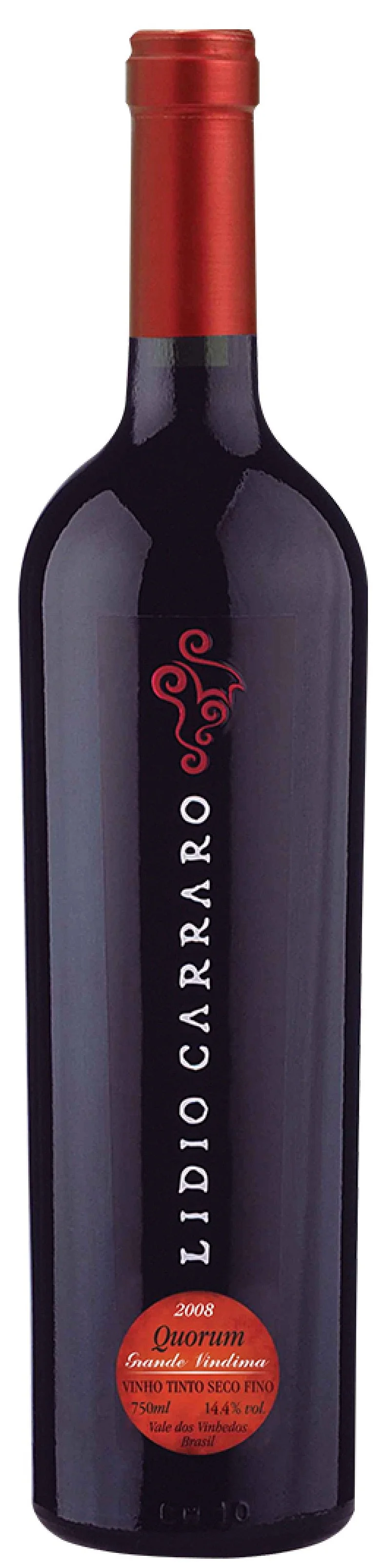 A bottle of red wine with a red foil capsule and a dark label that says 'LIDIO CARRARO' with a red and black emblem above and what appears to be a red circular sticker with additional text about the wine, vintage 2008, Quorum, Grande Lindina.