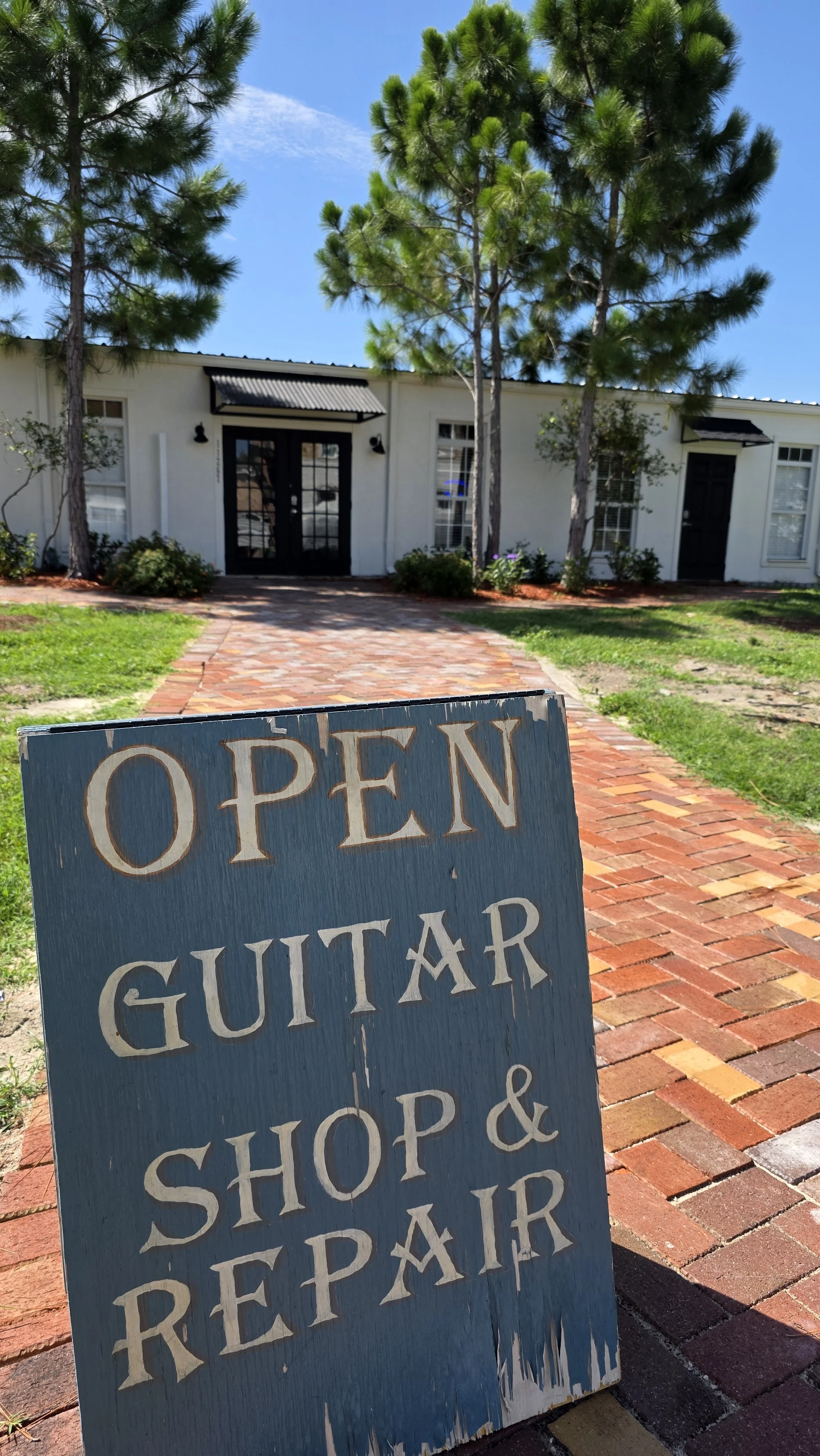 Shop and repair for guitars, open in an airstream