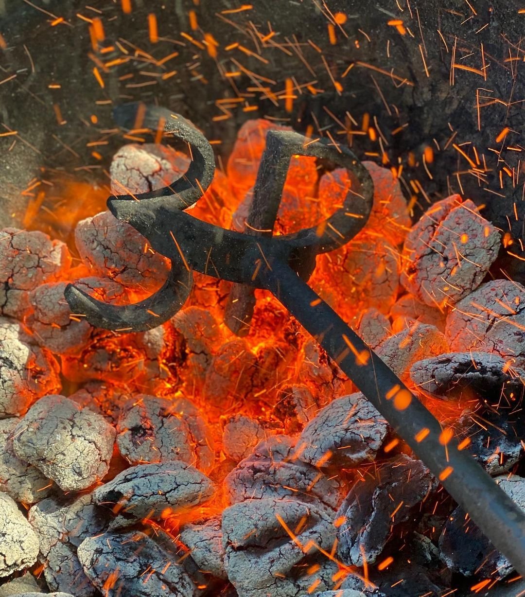 Hot coals heating up a 3P branding rod