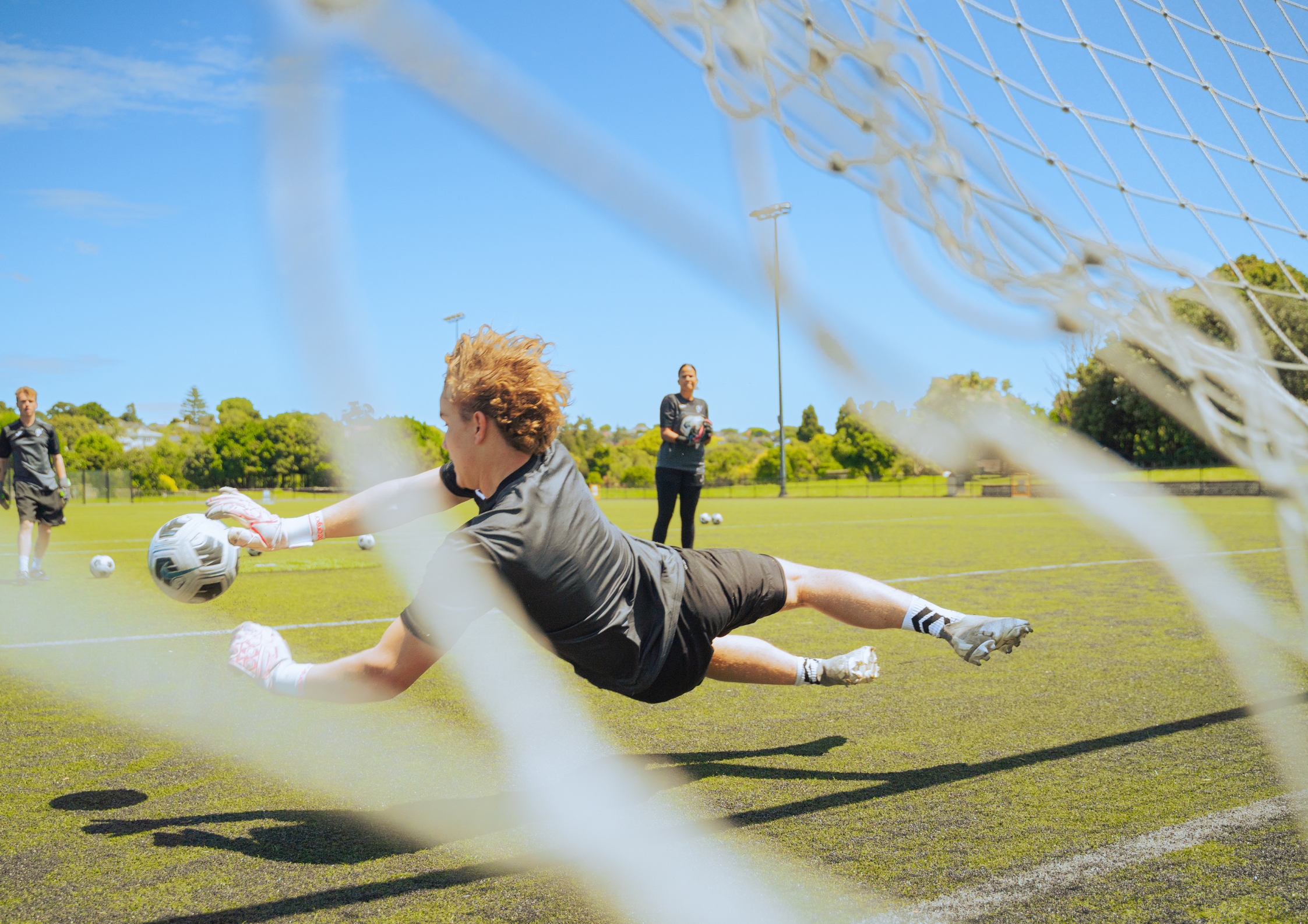 goalkeeper making diving save