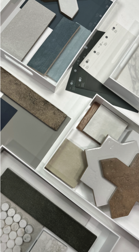 Display of various tile samples in different colors, shapes, and textures.