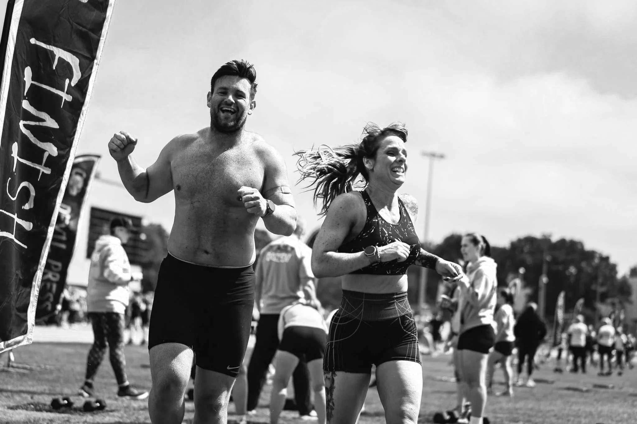 Male and female athlete competing at Deadly Dozen Uk Fitness race
