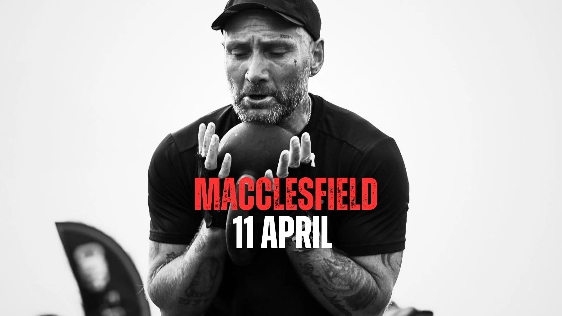 A woman is standing outdoors holding a weight plate above her head during a workout or training session.