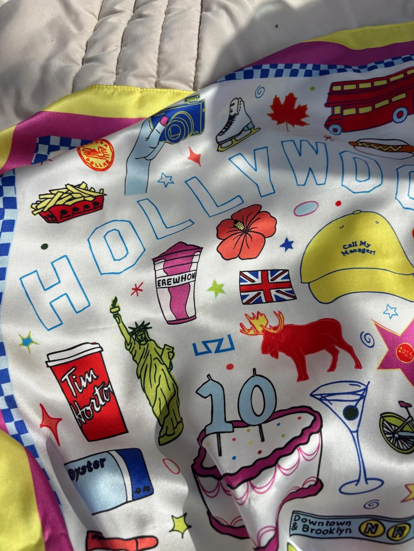 🎈Celebrating 10 years of @shinetalentgroup with this custom scarf designed by me. We included hand-drawn iconic elements from their 4 locations: London 🫖, NYC 🚕, LA 🌺+ Toronto 🥞 and it was gifted to all the team and talent. Thank you Shine for a