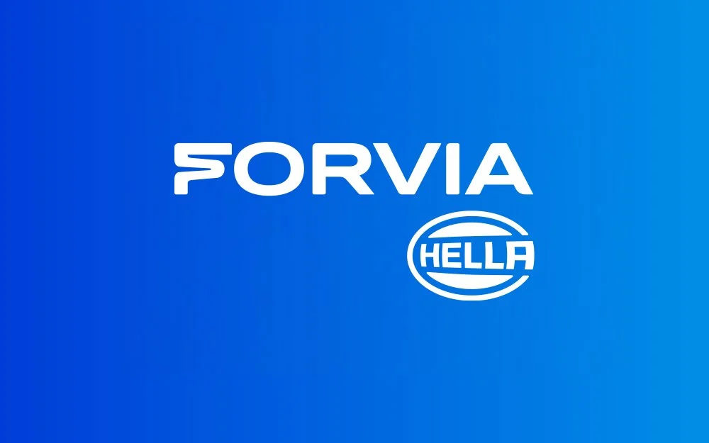 Blue background with white text that reads 'FORVIA' and a smaller logo with the word 'HELLA' inside an oval.