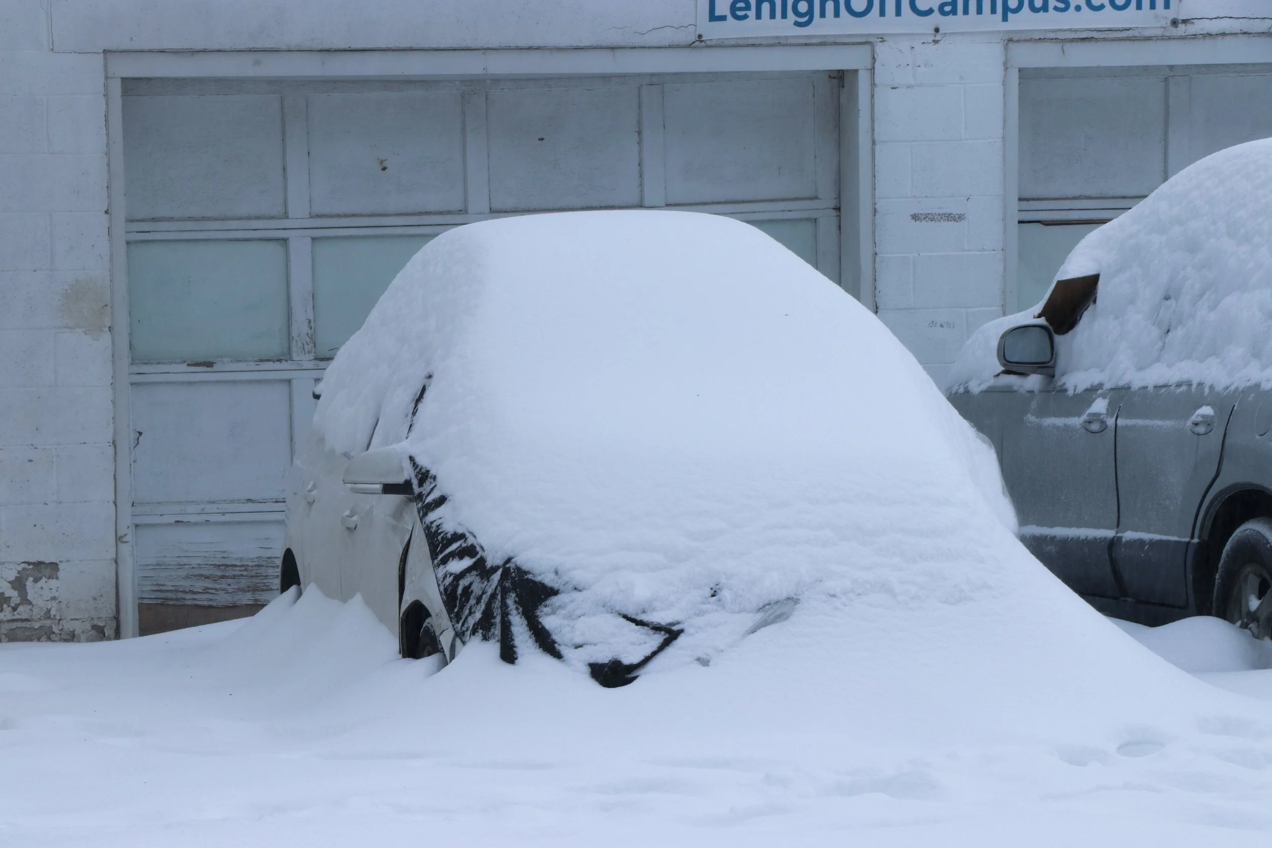 A car is pictured covered in snow off Lehigh’s campus. Although snow plows worked overnight to clear roads, many cars across the south side remain snowed in. (Luke Kaiser/B&W Staff)