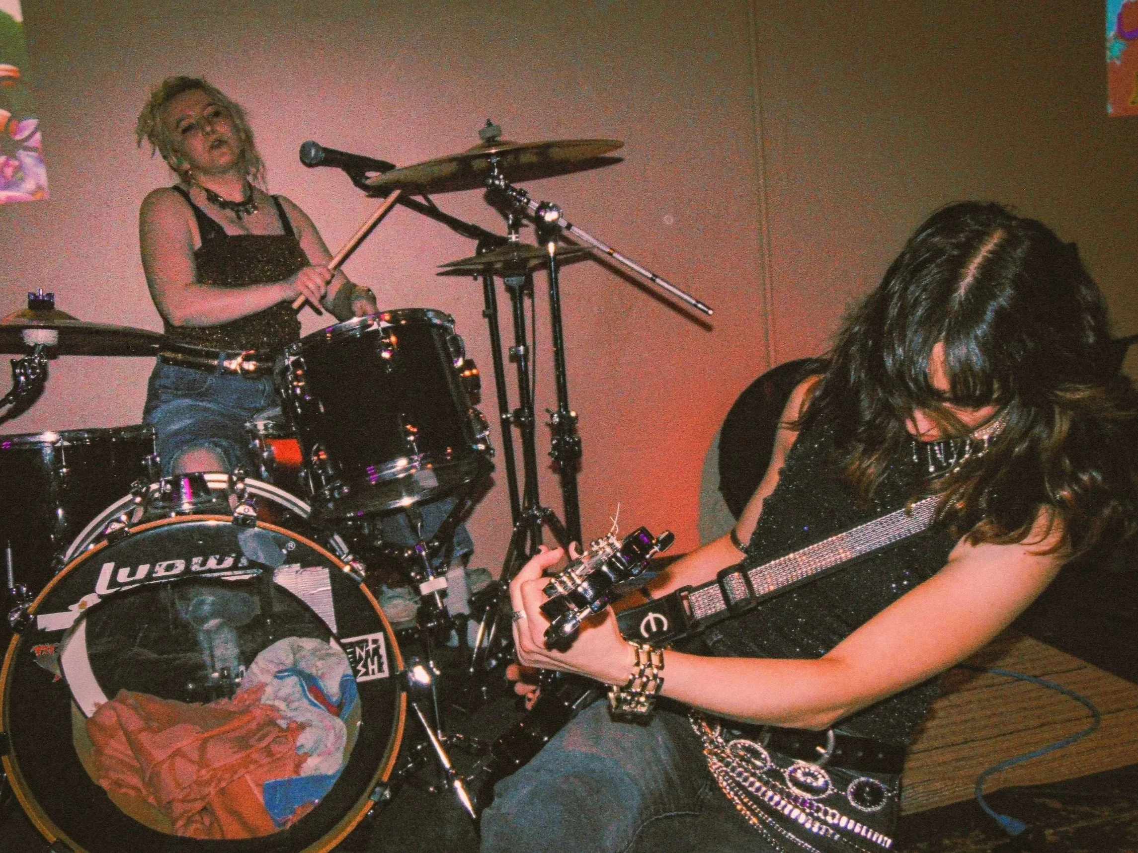 Bella Calamia and Sam Marencik of Leadpetal, a Lehigh Valley alt-rock band, rock out during a performance at 610 Fest in Allentown.