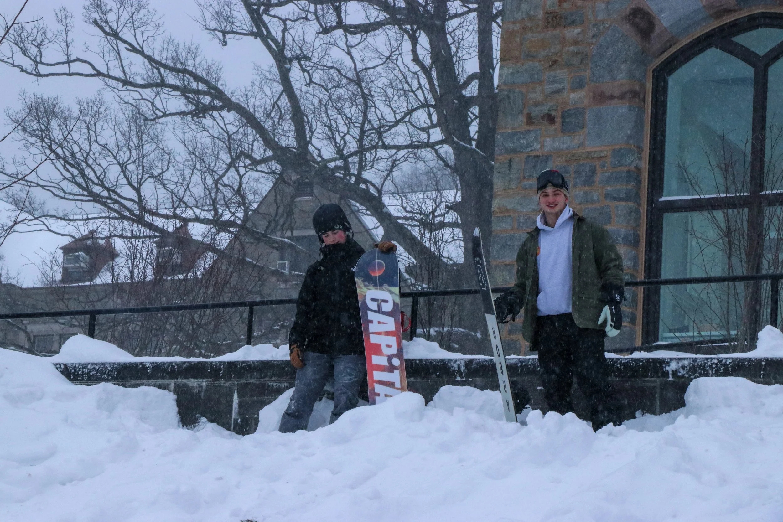 Students are pictured preparing to snowboard outside Lehigh’s Clayton University Center. Following a winter storm, students flocked to the hill to go skiing and sledding. (Luke Kaiser/B&W Staff)