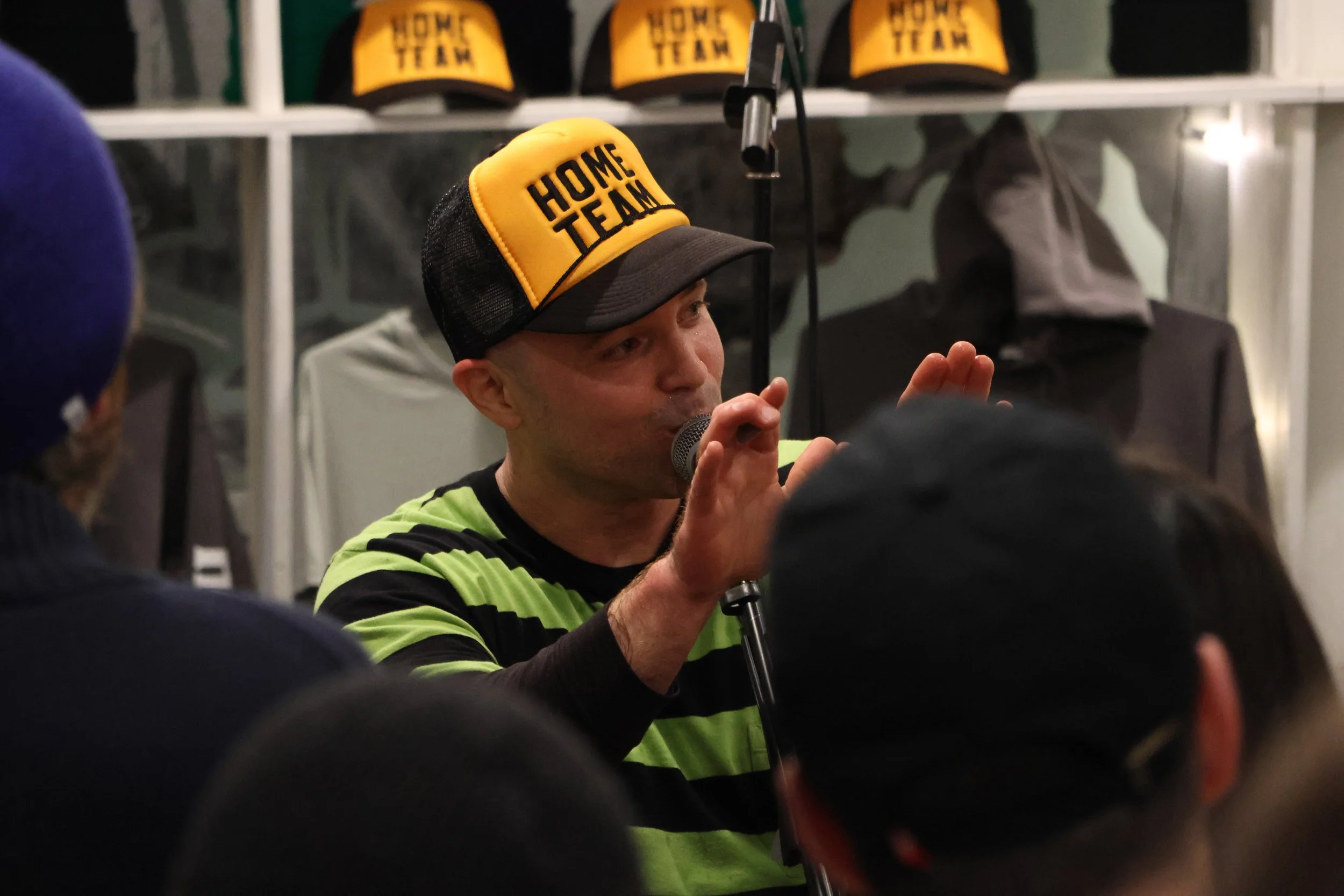 Chris Devlin, the lead singer of skate punk band Headzo, talks to a crowd of 60 plus during the band's set at the Homebase Skateshop. Headzo was one of three bands who performed to kick off Skate Shop Day weekend. (Luke Kaiser/B&W Staff)