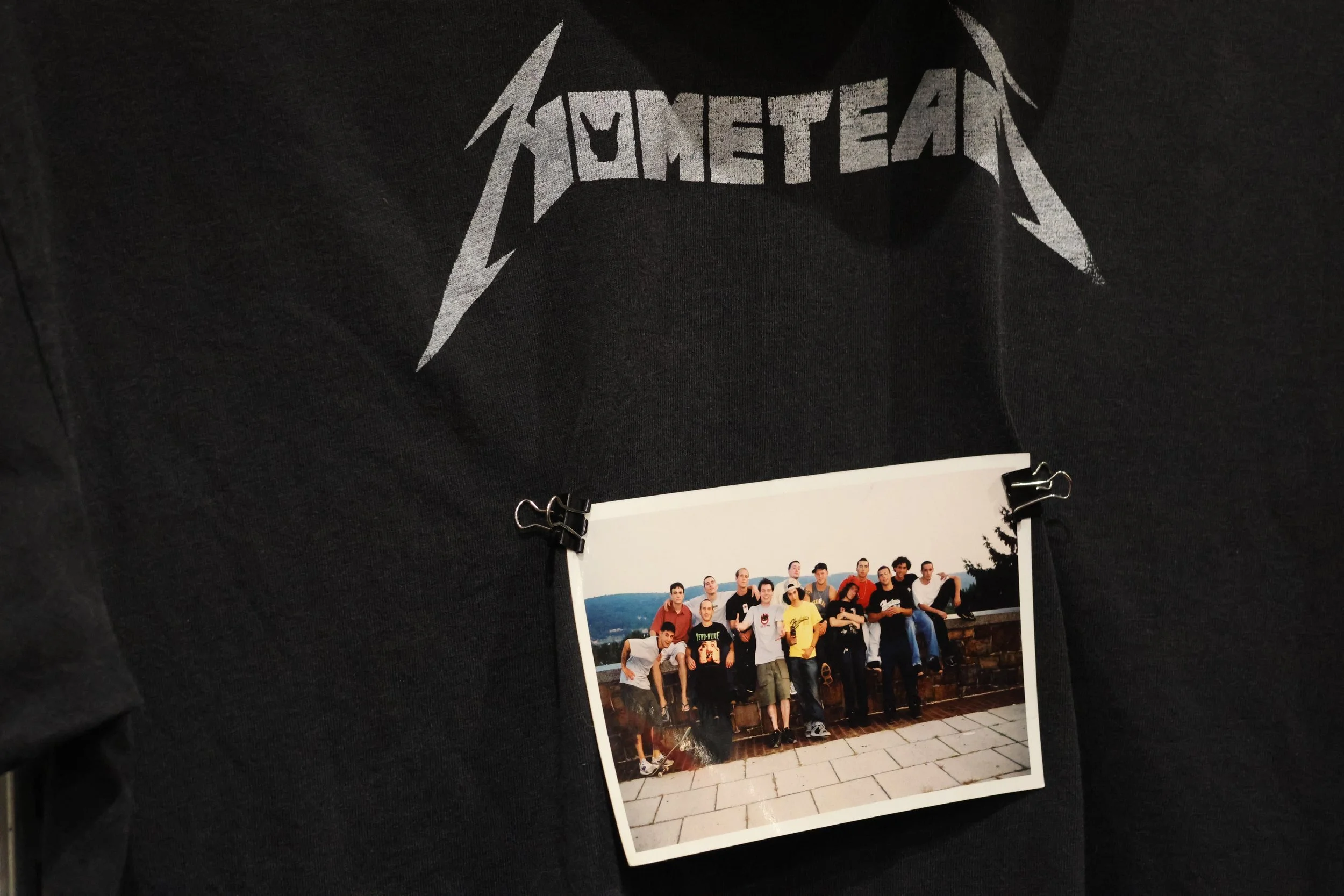 A photo of Homebase Skateshop founder Andy Po and Lehigh Valley skaters sits on a “Home Team” T-shirt. Po said most of the skaters in the photo contributed to “City Without Spots,” the Lehigh Valley’s first skate video. (Luke Kaiser/B&W Staff)