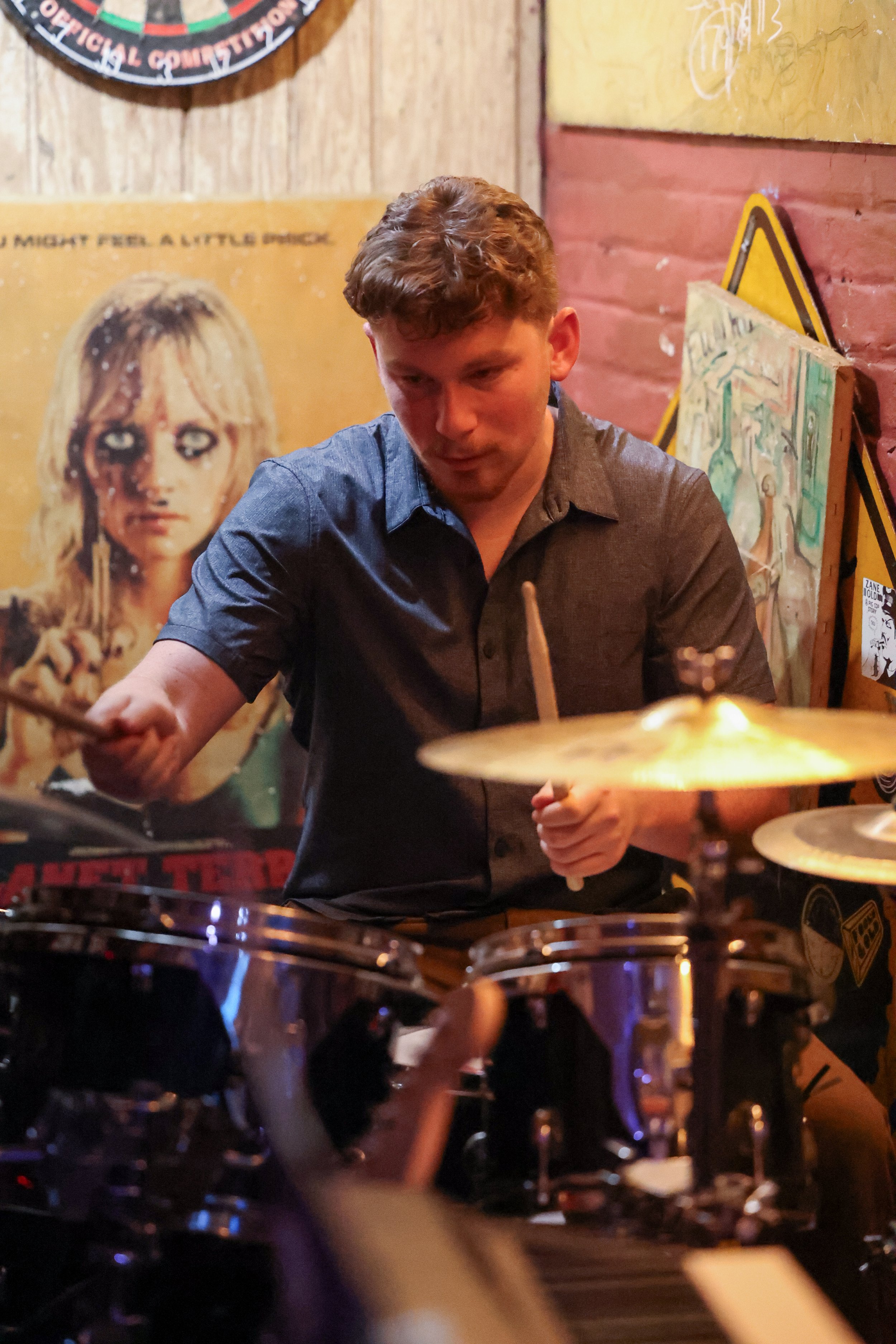 Thomas Kelly fills in on drums during a live performance. (Luke Kaiser)