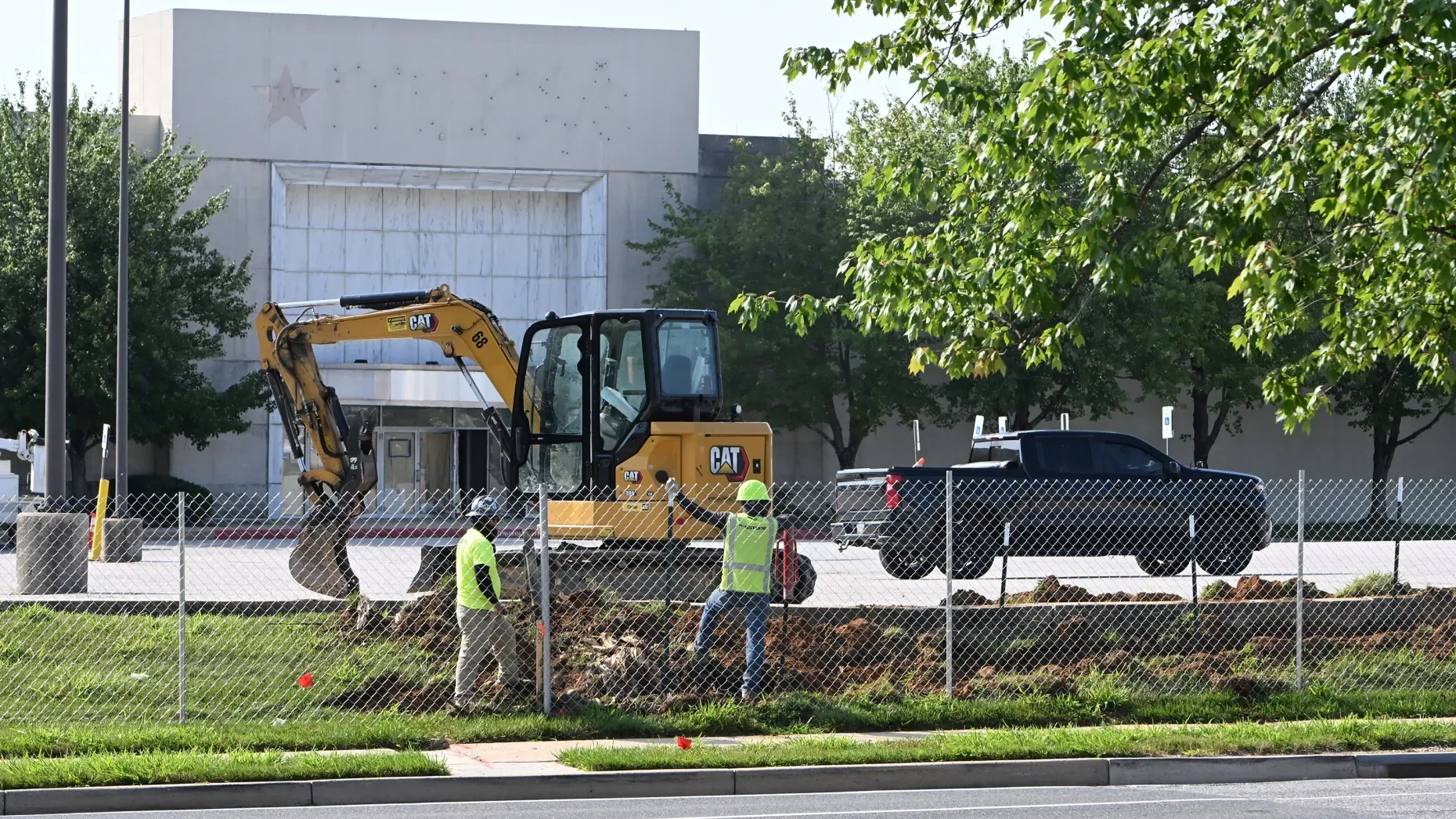 Crews work on the perimeter of the Harford Mall property as demolition of the former Macy’s portion begins on Tuesday. (Brian Krista/Staff)