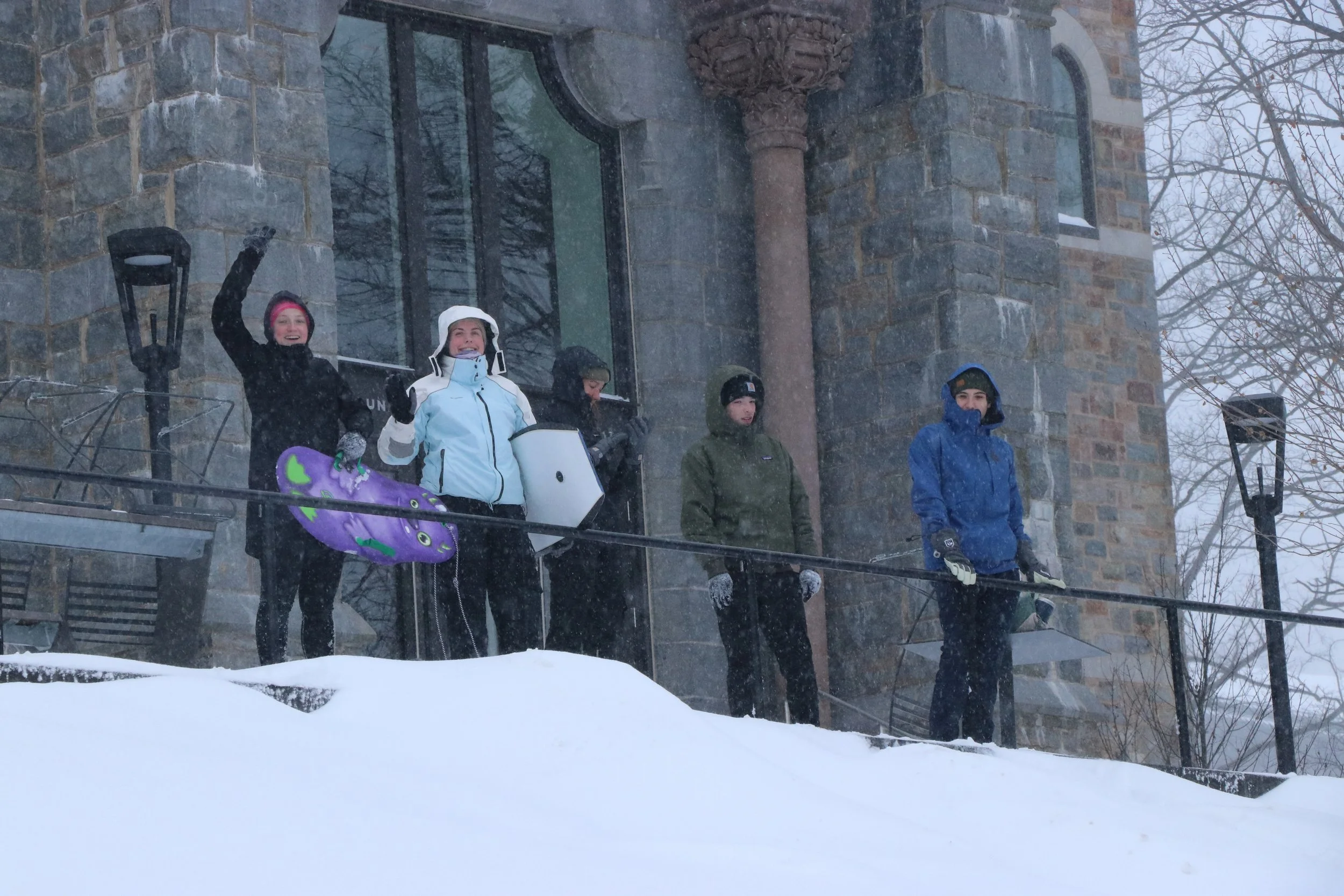 Students are pictured preparing to sled down a hill outside Clayton University Center. Following Sunday’s winter storm, students brought sleds and skis to ride down hills across campus. (Luke Kaiser/B&W Staff)