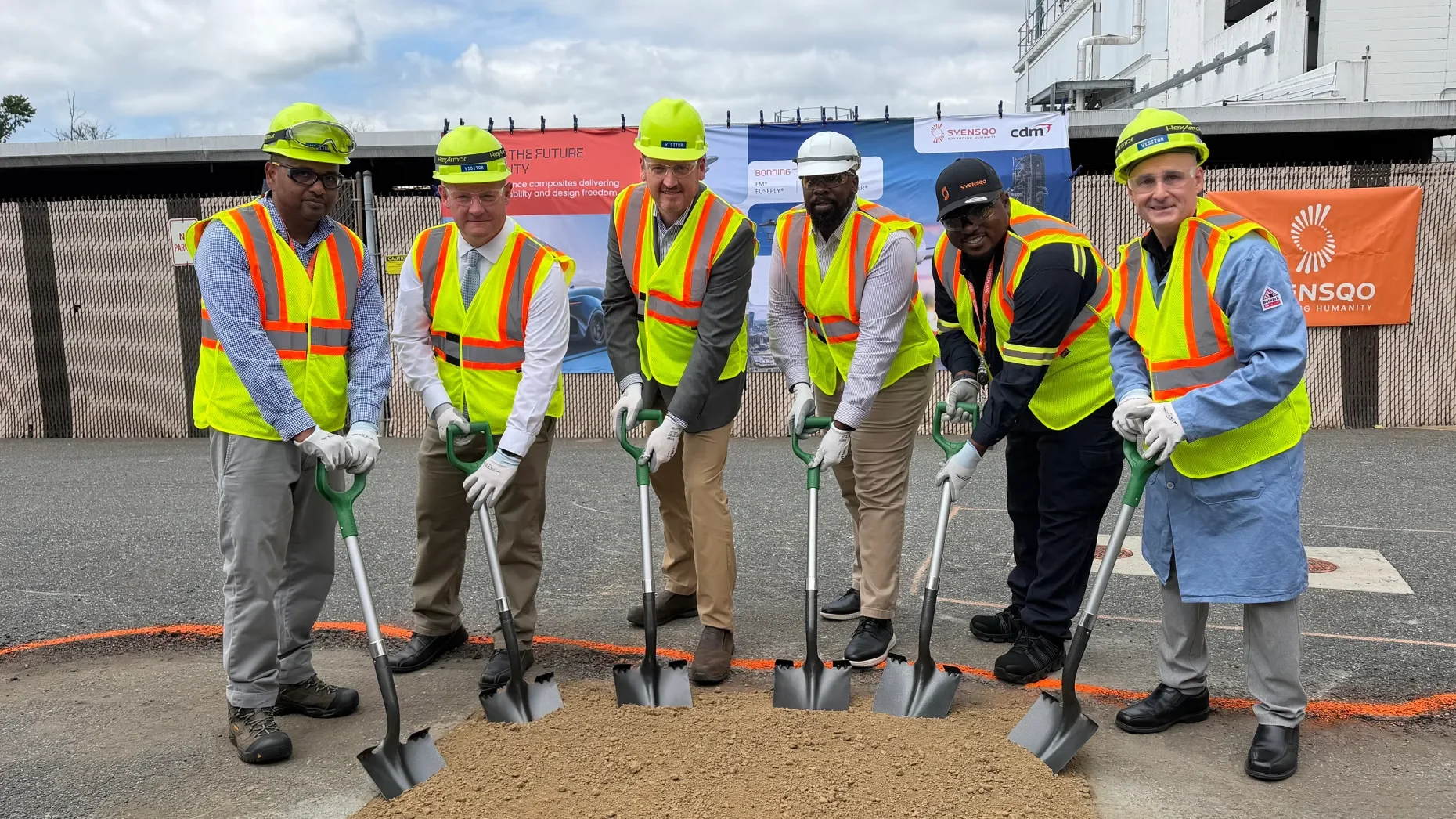 Employees of aerospace materials manufacturer Syensqo and Havre de Grace Mayor Bill Martin dig into a plot to celebrate the company’s groundbreaking ceremony Wednesday. The ceremonial dig represents the location for a multimillion-dollar facility exp