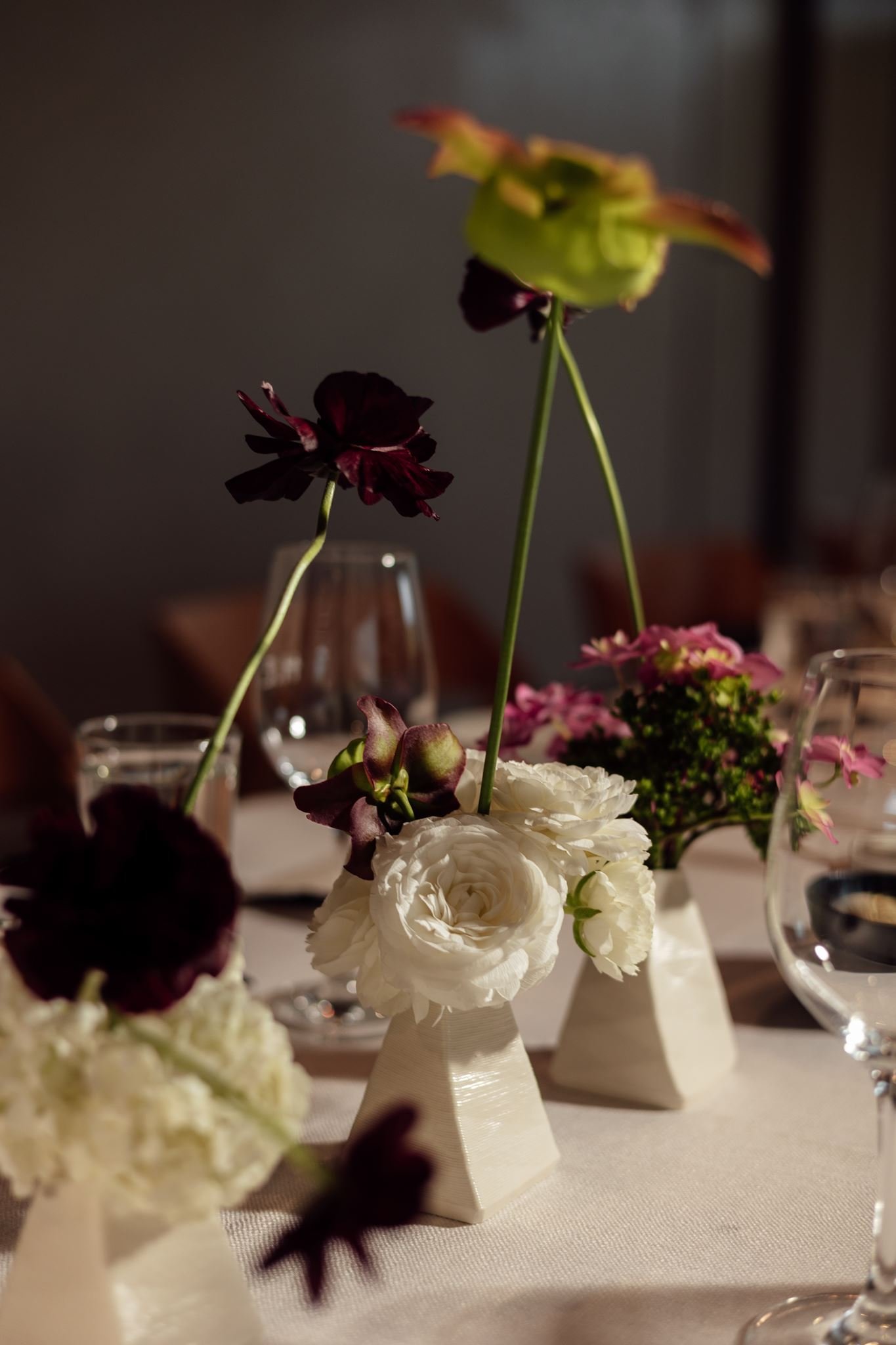 Wedding flowers in ceramic vases for reception tables at Harriet Hubert Estate 