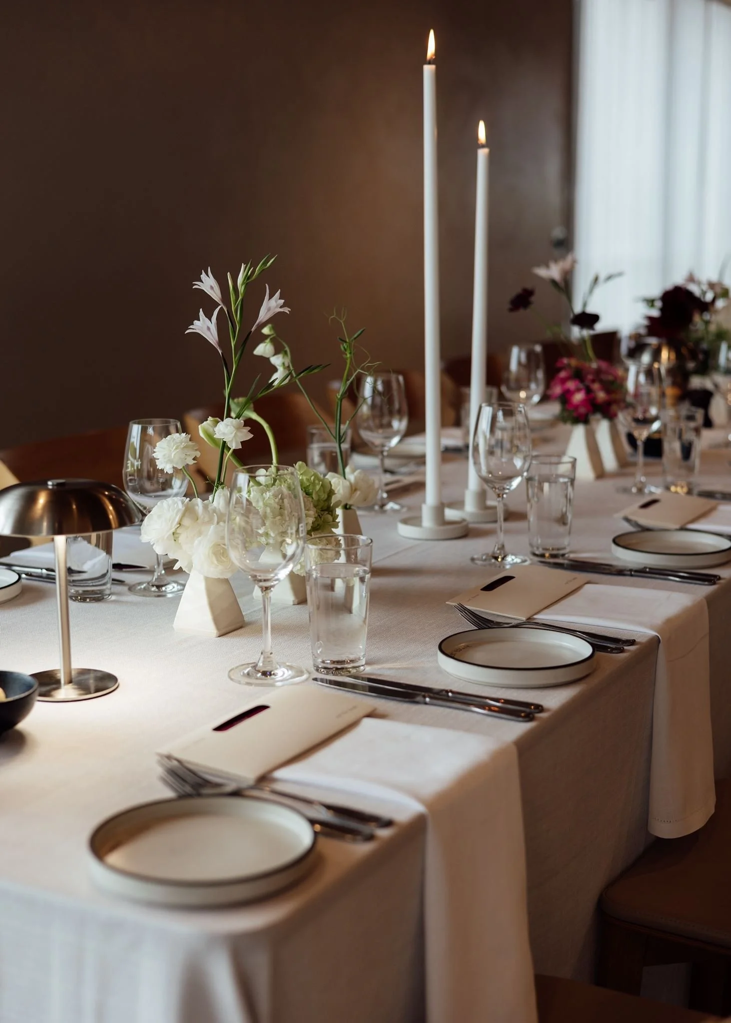 Wedding flowers in ceramic bud vases at Harriet Hubert Estate 