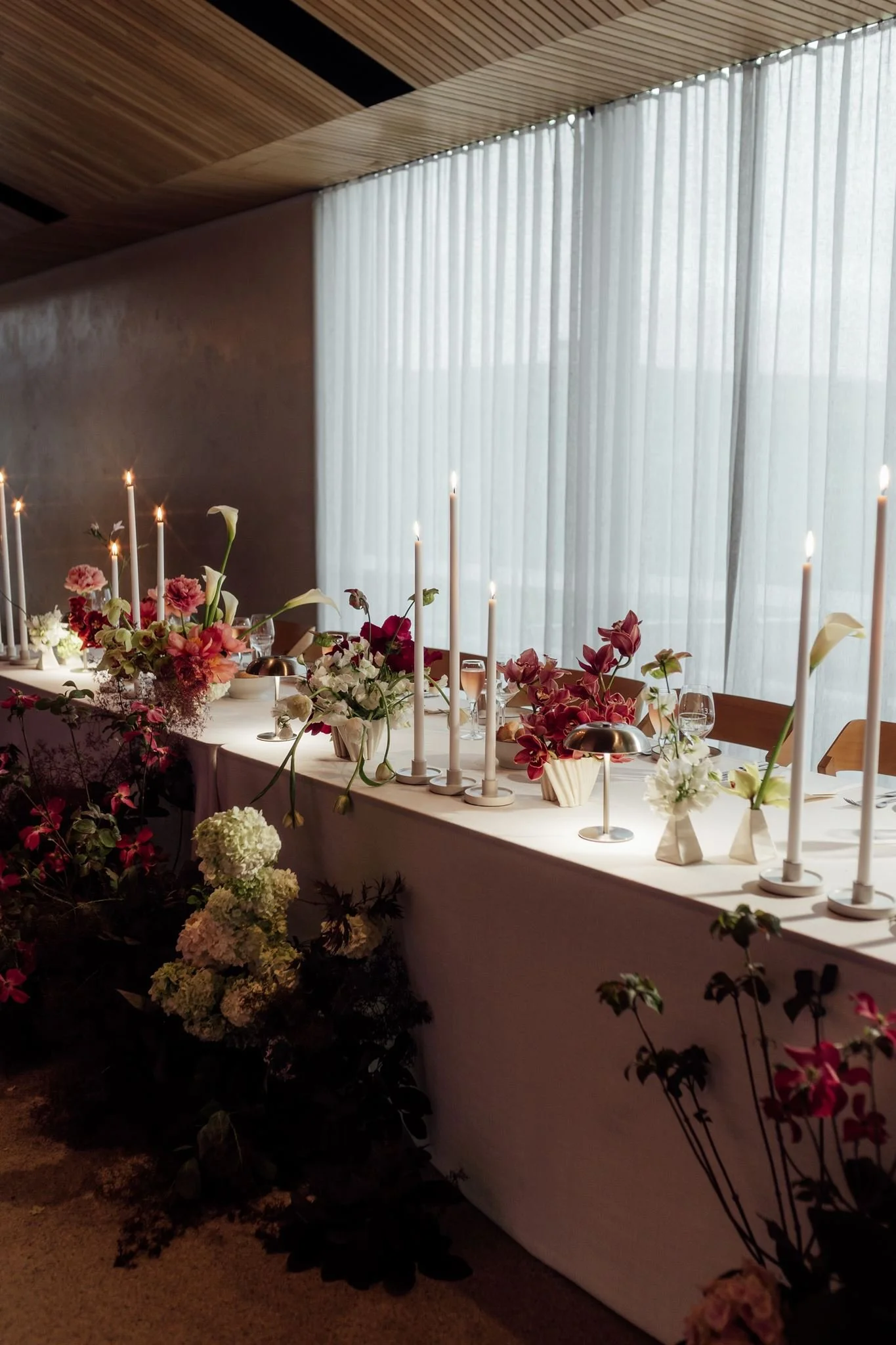 Wedding flowers in ceramic vases for reception tables at Harriet Hubert Estate 