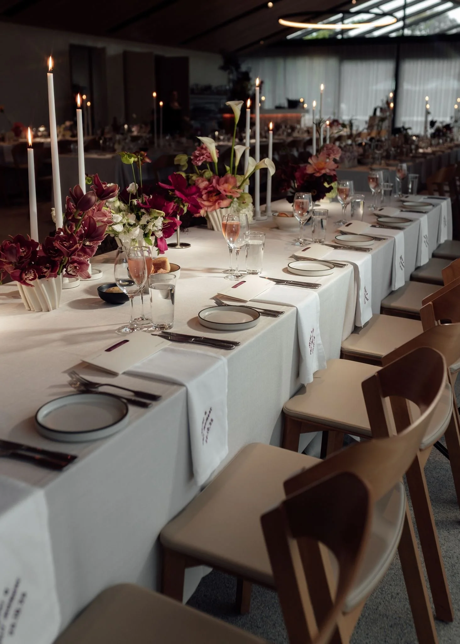 Wedding flowers in ceramic vases for reception tables at Harriet Hubert Estate with 