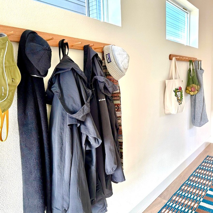 Versatile storage with dowel pegs for coats, bags, and more.