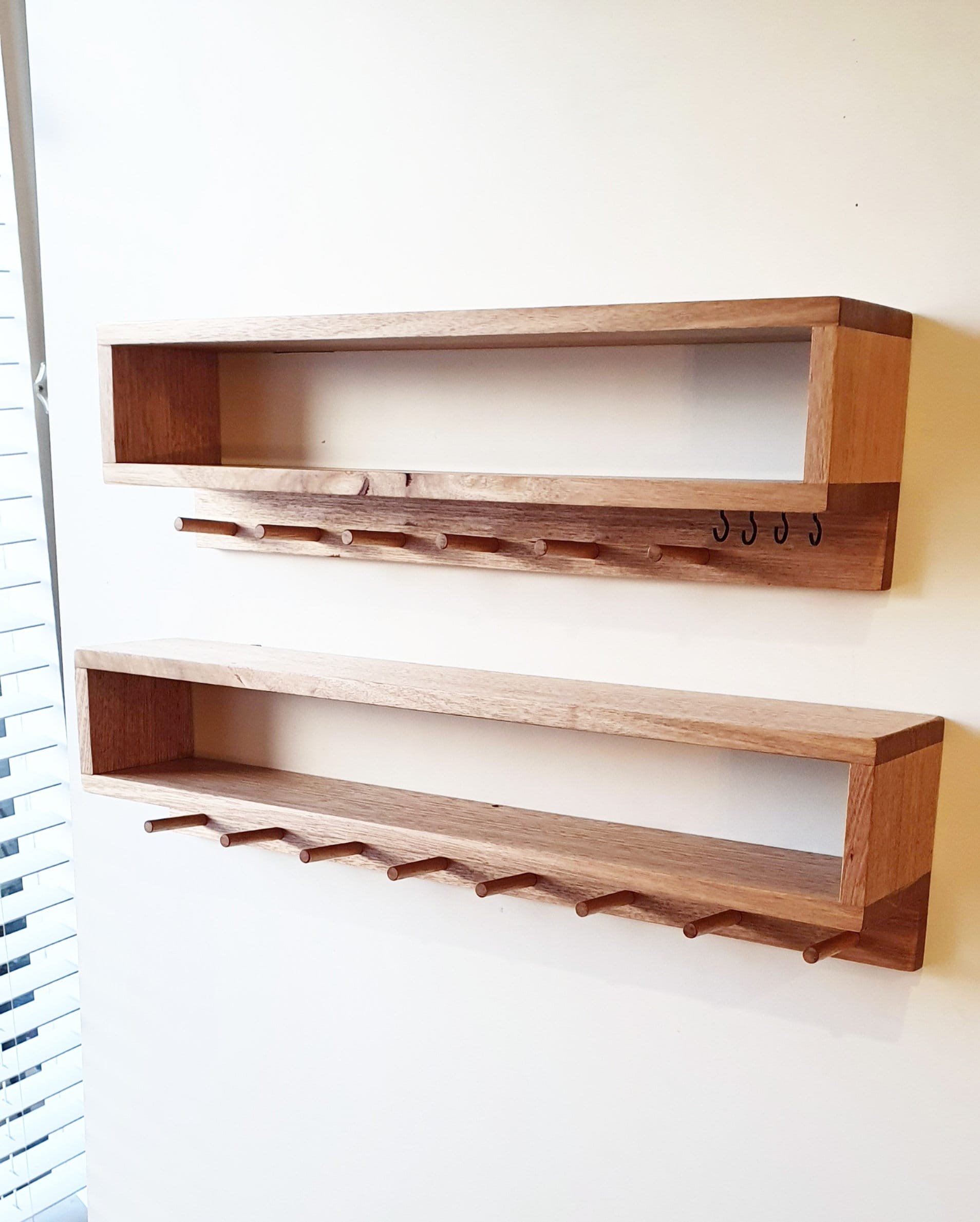 Oak or pine entry organisers with dowel pegs for hanging.