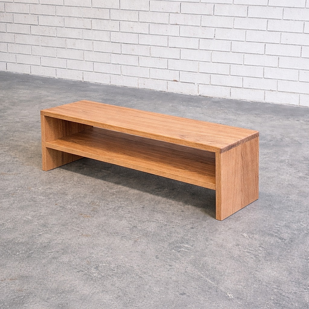 Minimalist oak bench in industrial space (1).png
