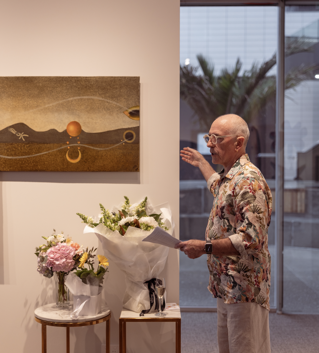 Nigel Banks of Sala Gallery explaining We Are The Earth's hero painting, Billboard, in his art studio in Tauranga, New Zealand