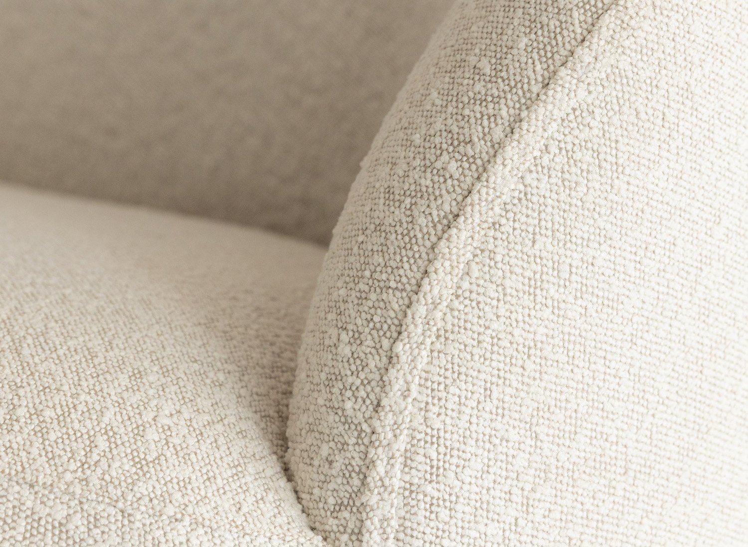 Close-Up of Maison Sauvage Sofa's White Bouclé Fabric Detail